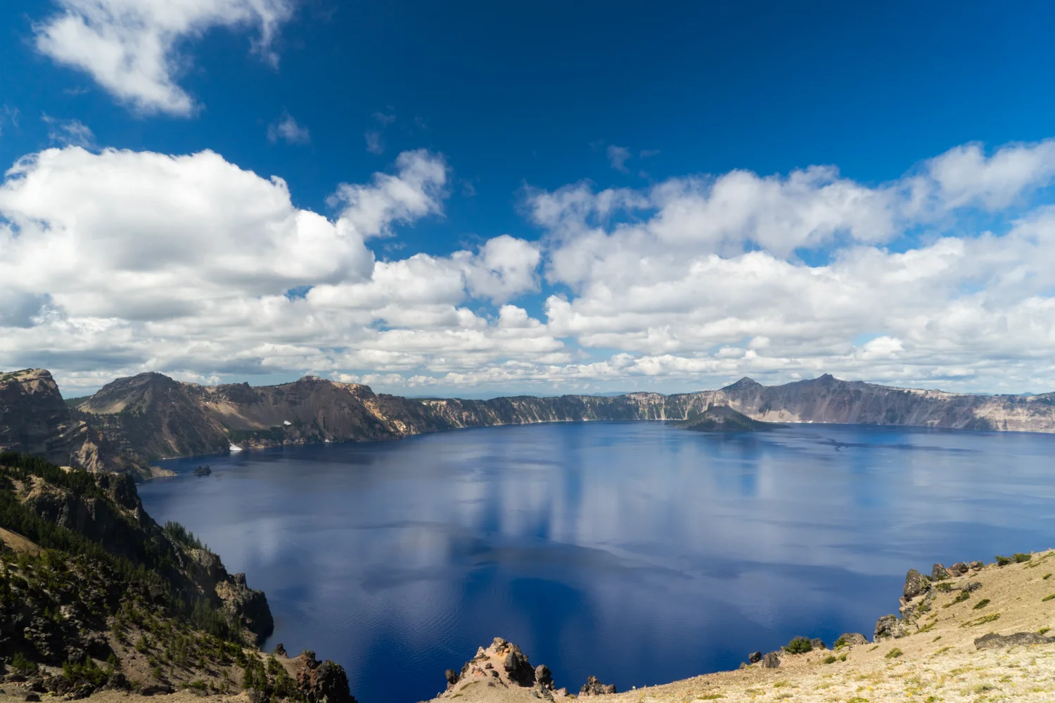 Blue skies and bluer than blue water bring out the beauty of Cratyer Lake in Oregon.