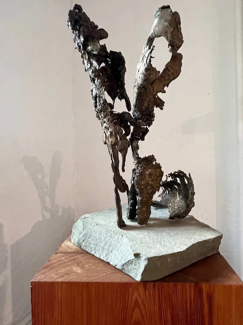 The series of smaller sculptural groupings exhibited in the interior are also constructed from fragments of the sand-cast military scrap and mounted on pedestals of recycled 200 year old red and yellow pine structural beams. Surrounding are images o