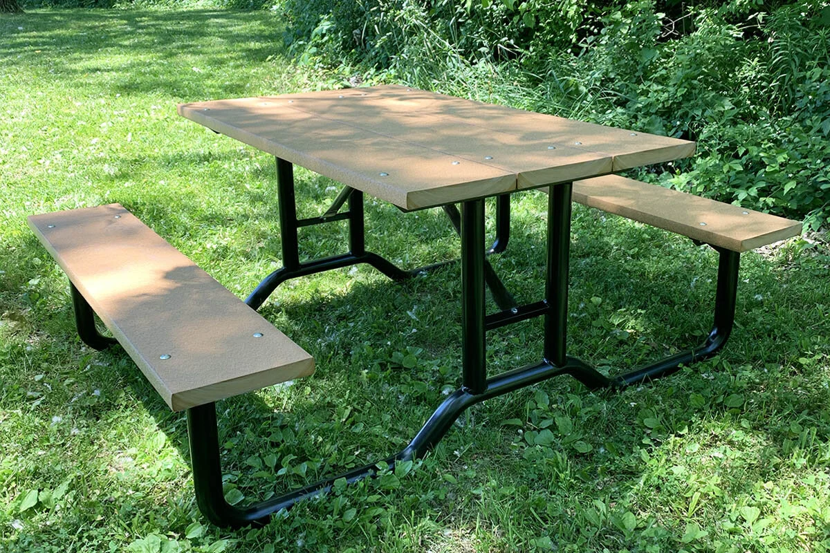 4ft steel frame picnic table with Cedar recycled plastic lumber top and bench seats installed on a concrete pad at an outdoor park site — manufactured by Advantage Outdoor Products in Grand Rapids, Michigan