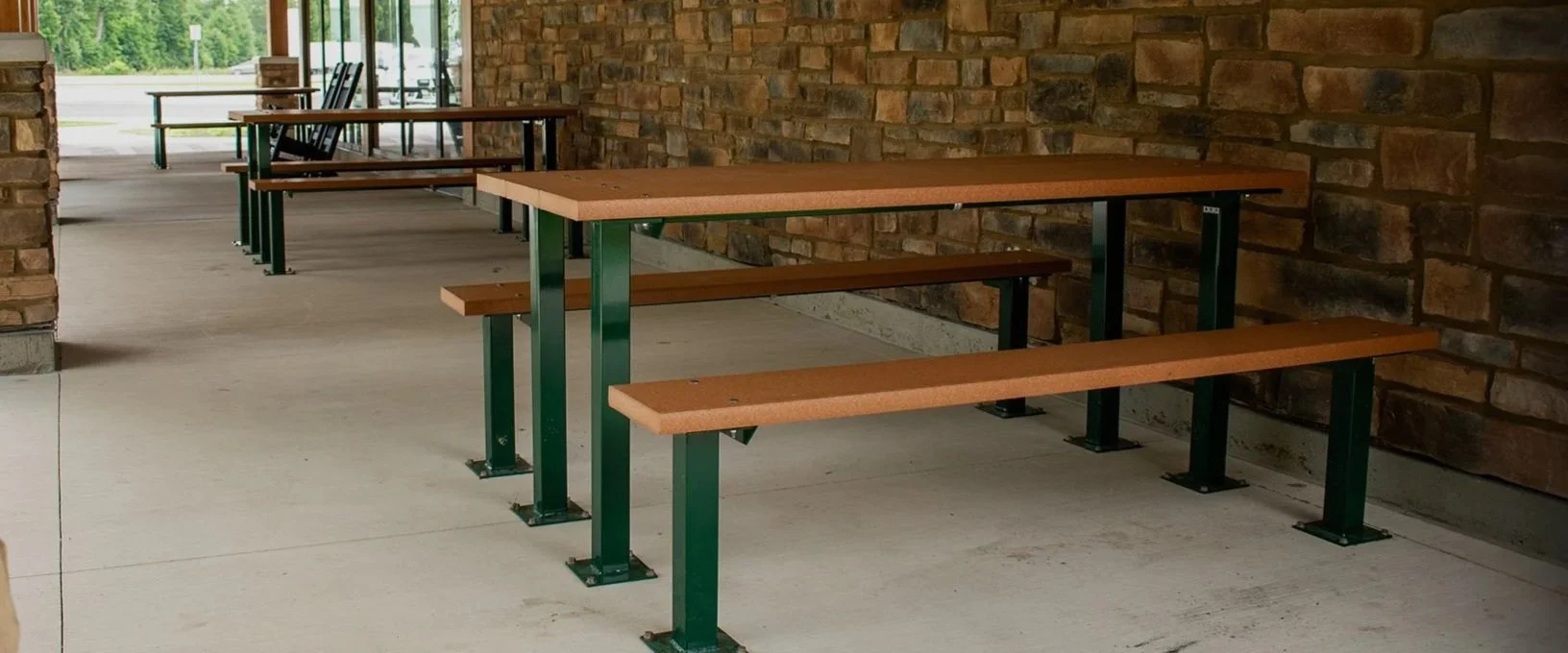 6ft Cambridge Picnic Table with multi-pedestal square steel frame and Cedar recycled plastic lumber, installed under a park pavilion.