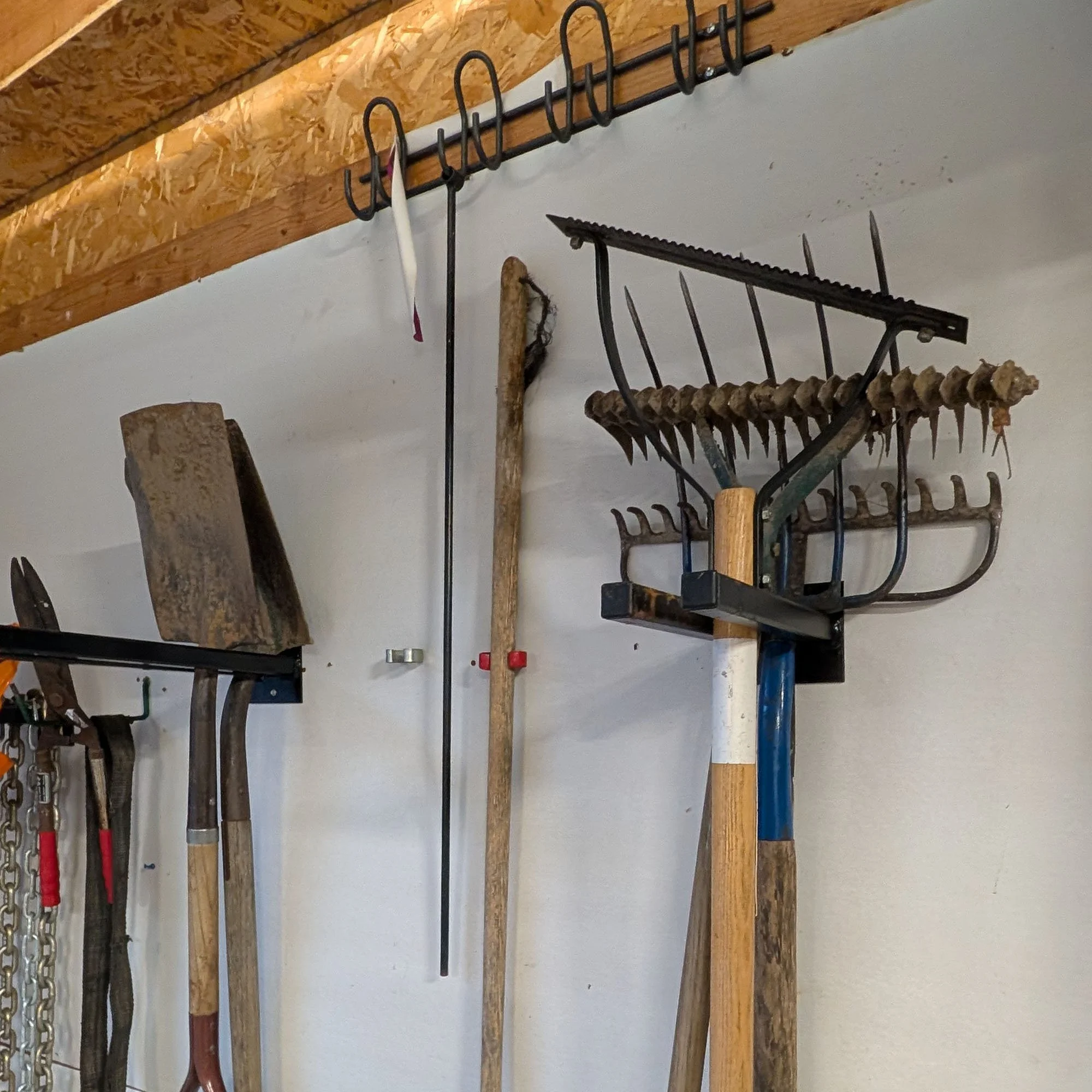 12 inch double prong tool rack loaded with tools installed in garage