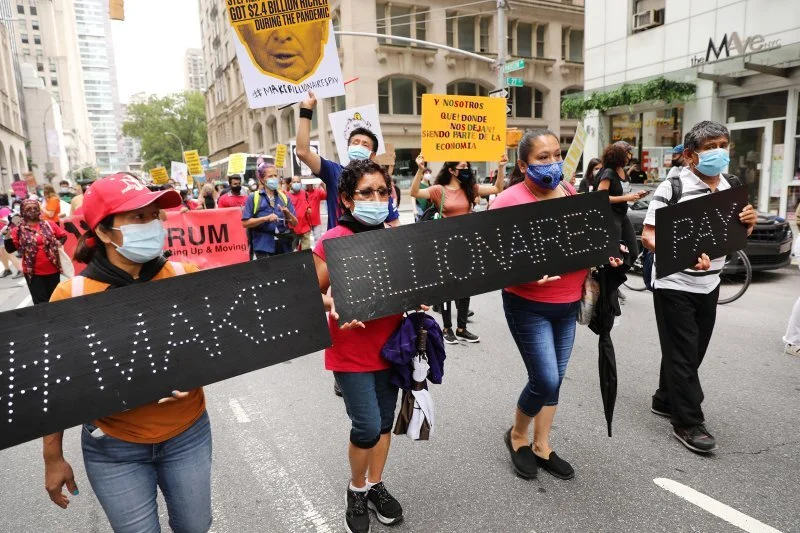 People participate in a "March on Billionaires" event on July 17 in New York City (Spencer Platt—Getty Images.)