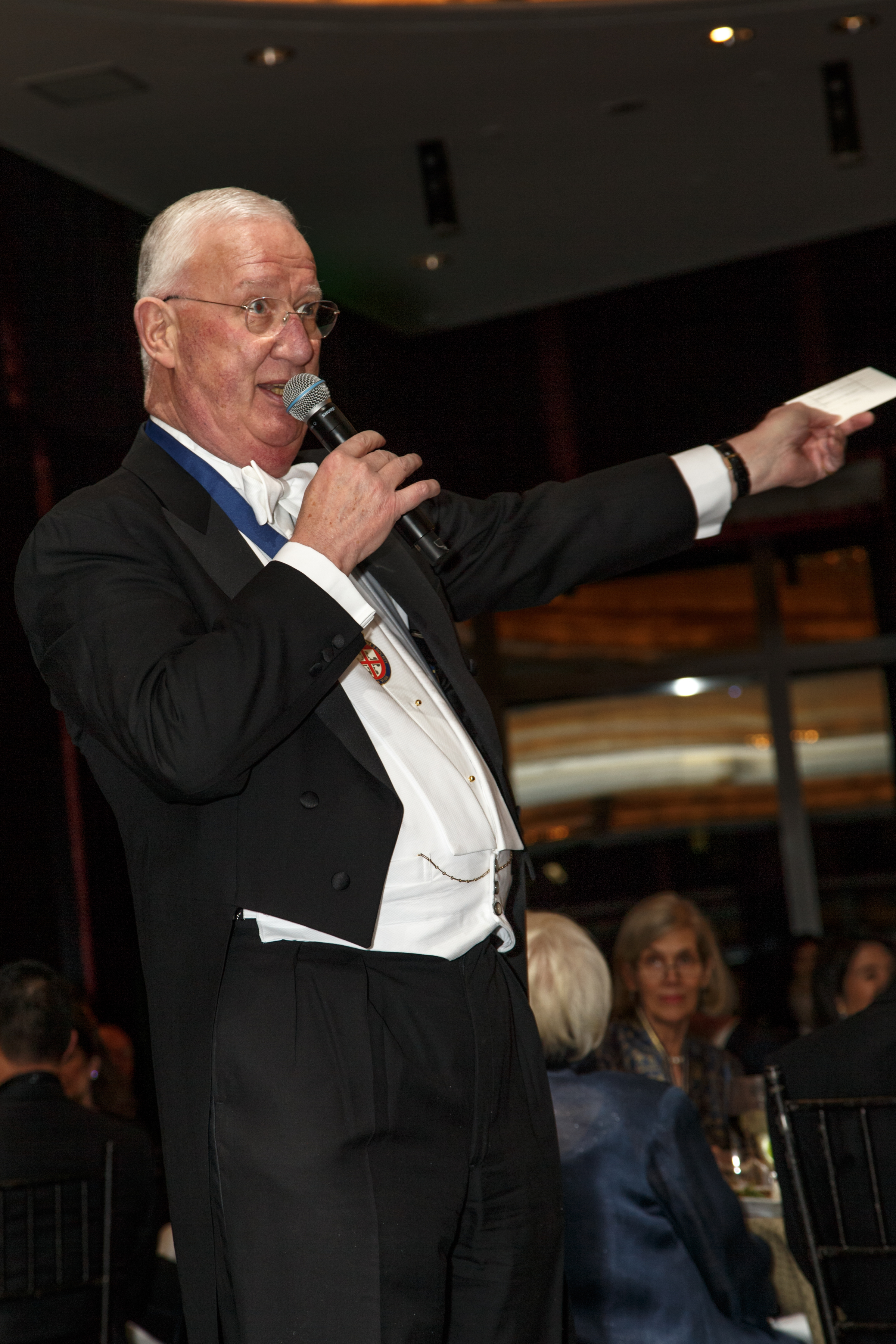  C. Hugh Hildesley leads the "Fund-A-Scholar" auction 