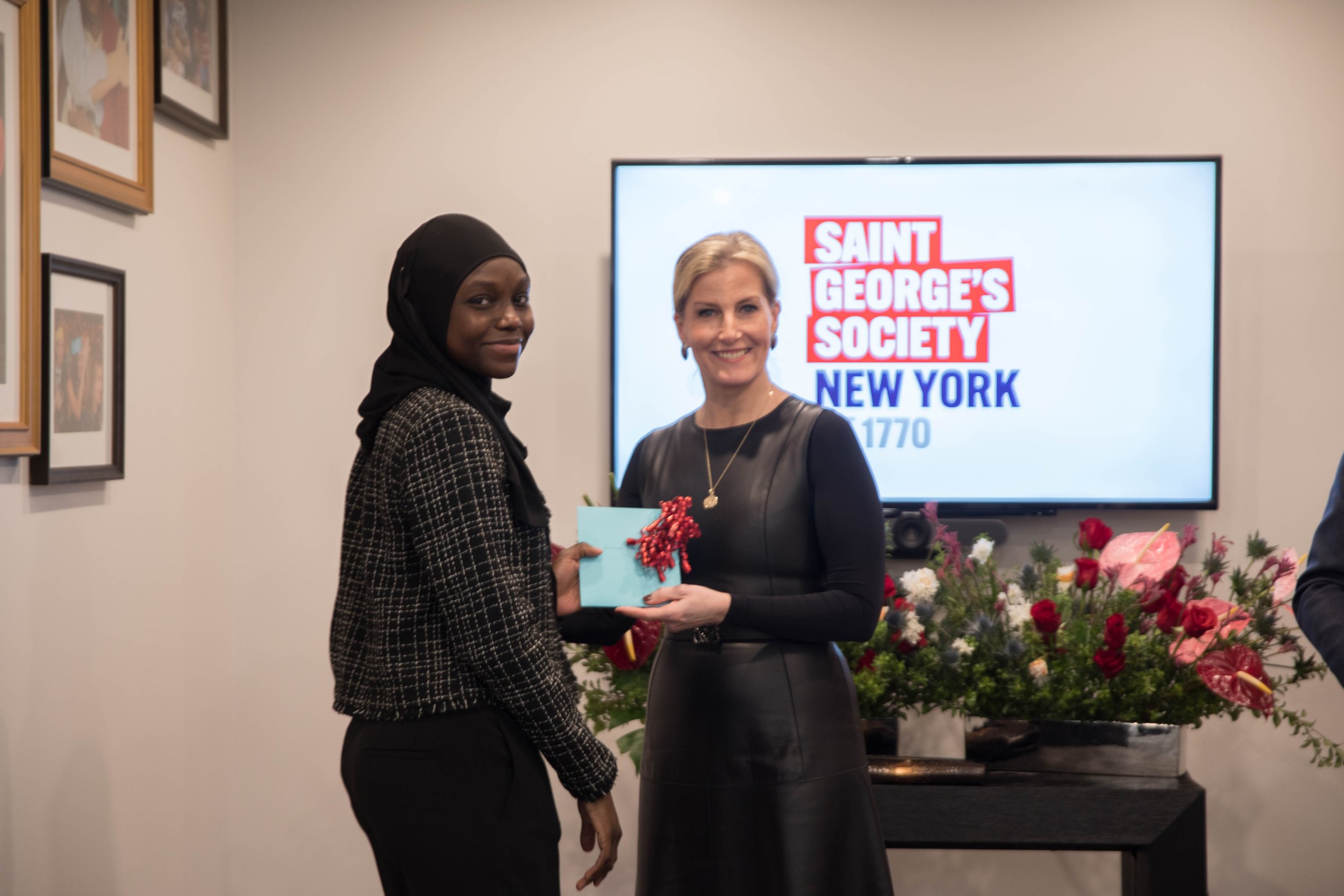  An SGSNY Scholar receives a congratulatory graduation gift from The Countess 