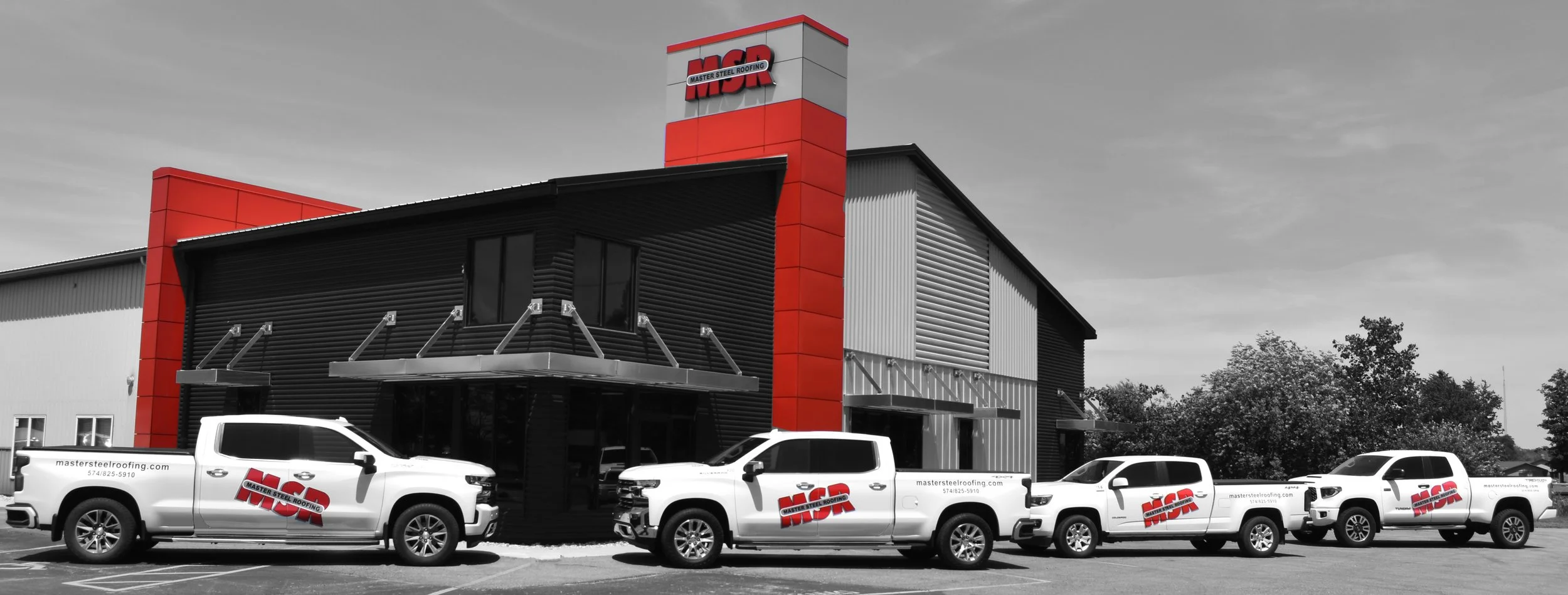 Master Steel Roofing Office Building- Matte Black Siding, Company Trucks