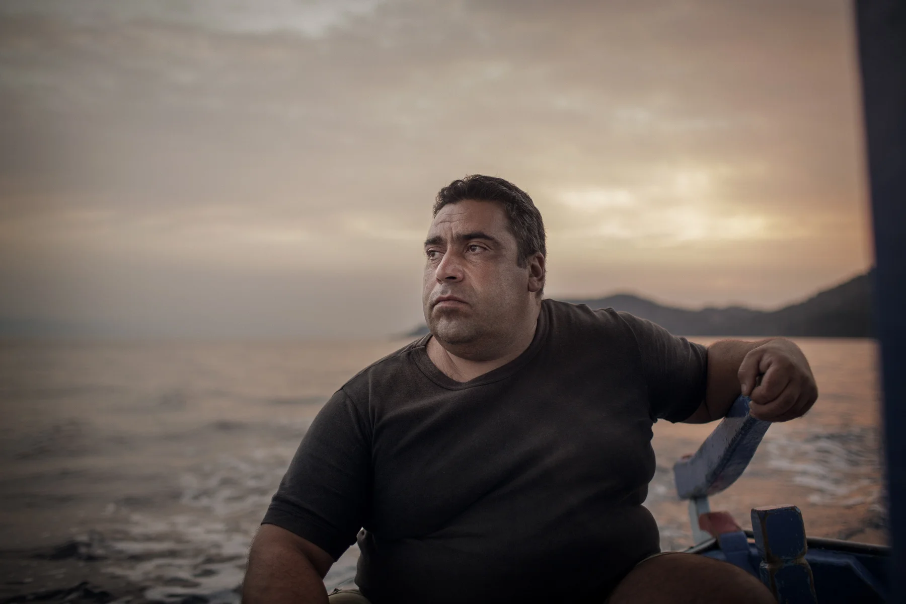 Kostas Pinteris steers his fishing boat back to the port after an unsuccessful morning of fishing, Skala Sykamineas, Lesvos, Greece. When refugees started arriving near the small village he and other locals rescued countless refugees by pulling their boats to the safe shore. 