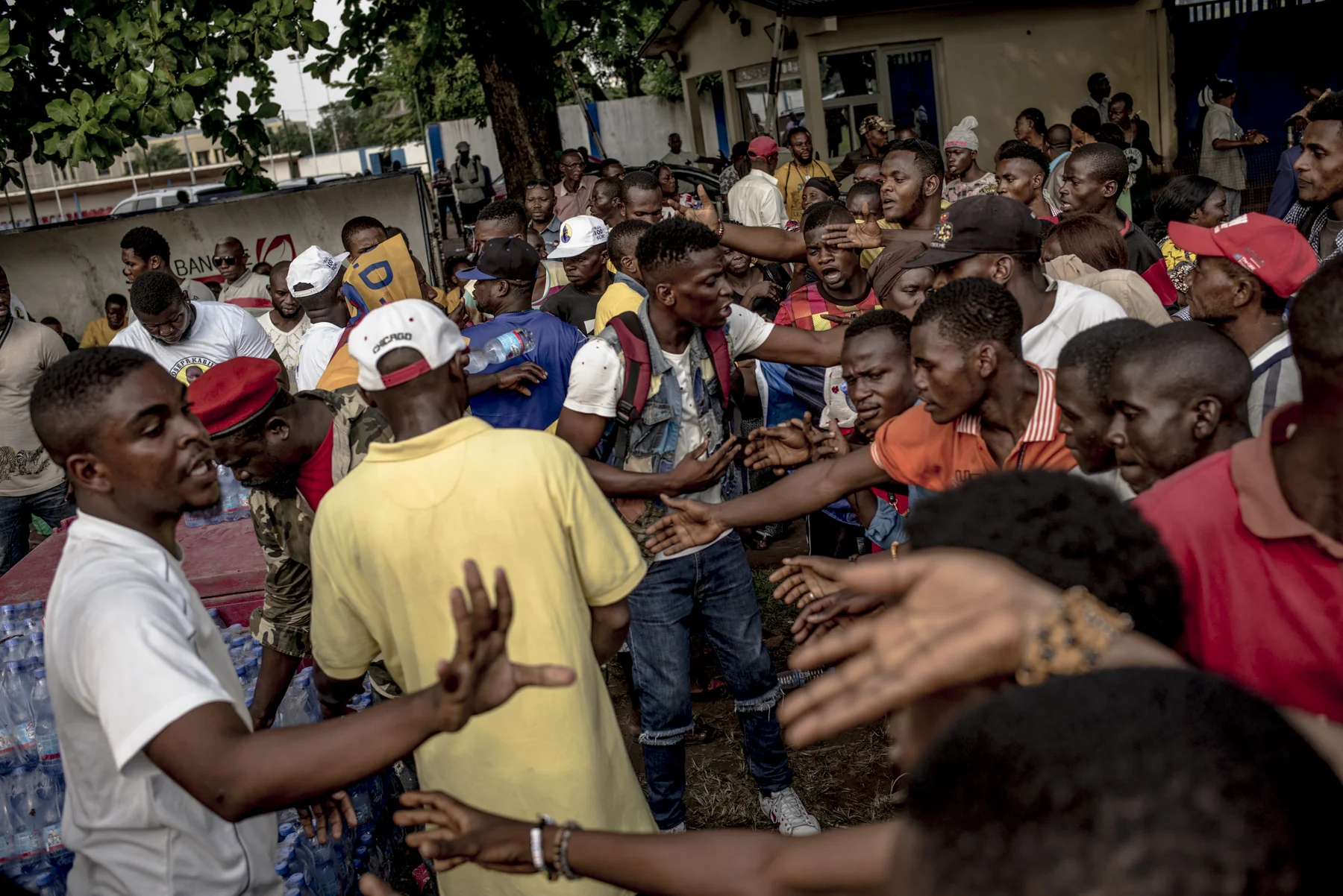 People fight for free food and drinks at a celebration of the 20th anniversary of the overthrow of Mobutu Sésé Seko by Laurent-Désiré Kabila, the father of President Joseph Kabila. 