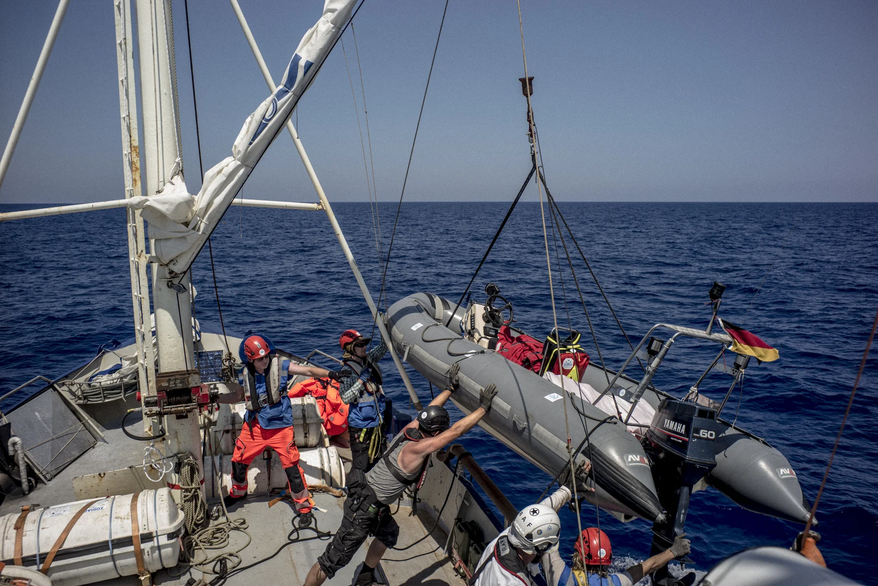 The crew of the Sea-Watch launches the vessel's tender boat before a search and rescue operation off the coast of Libya.