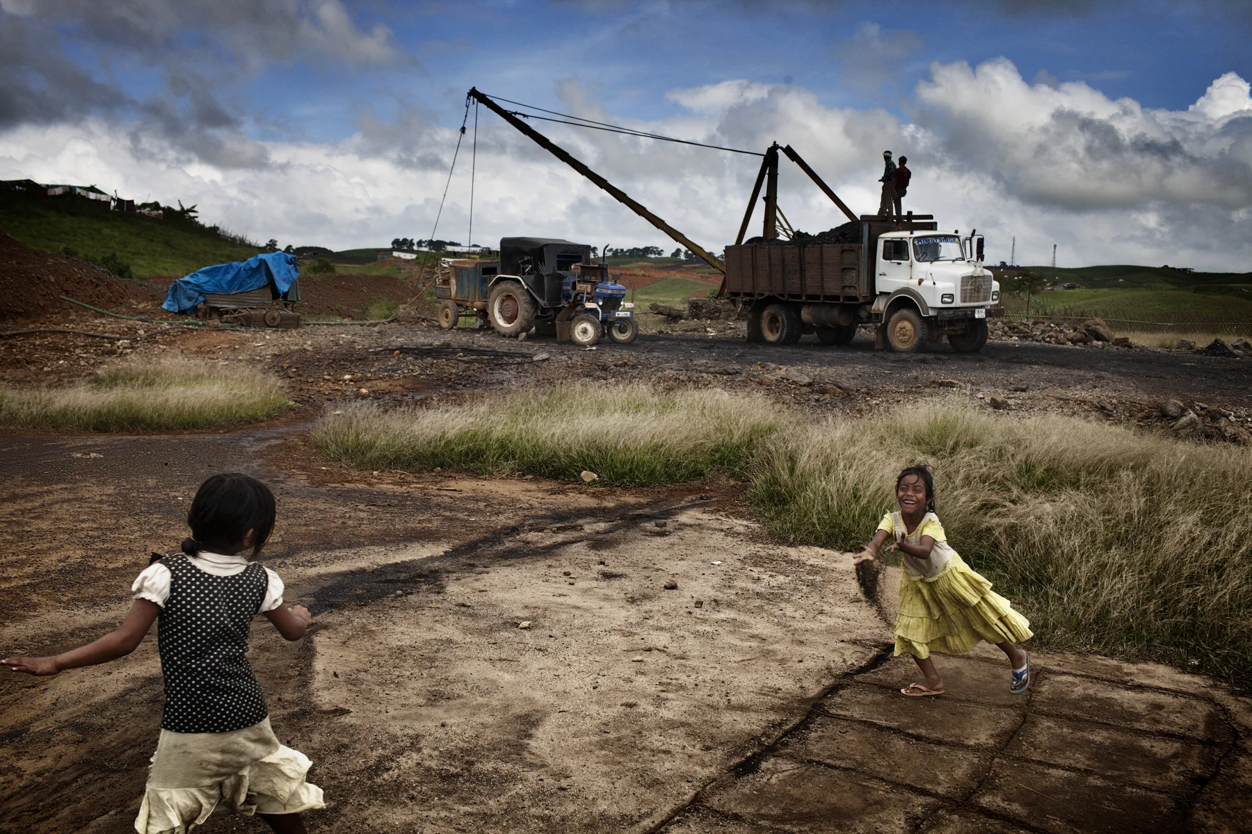 Girls play in front of a coal mine in the Jaintia Hills in the Indian state of Meghalaya. 