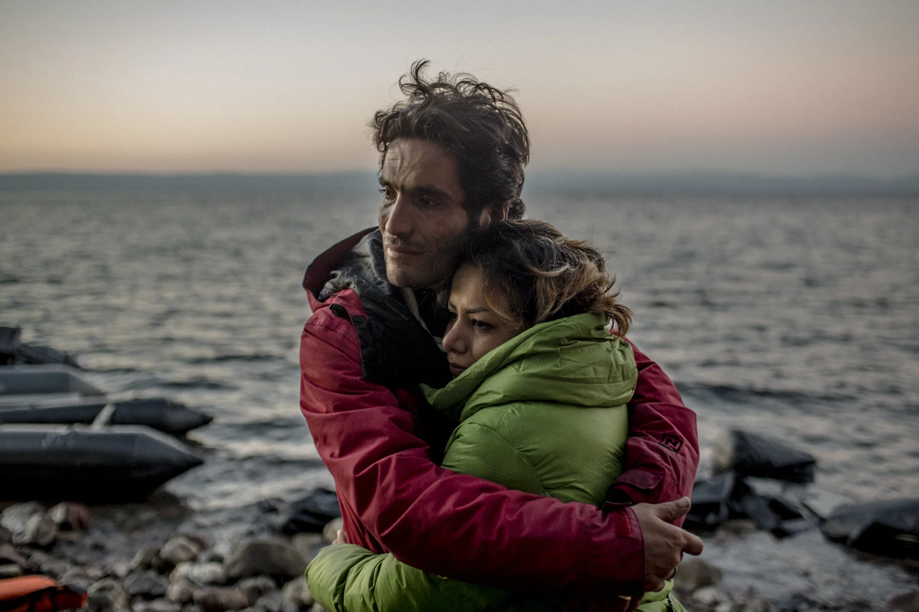 An Iranian couple embraces after they arrived on the Greek island of Lesbos.