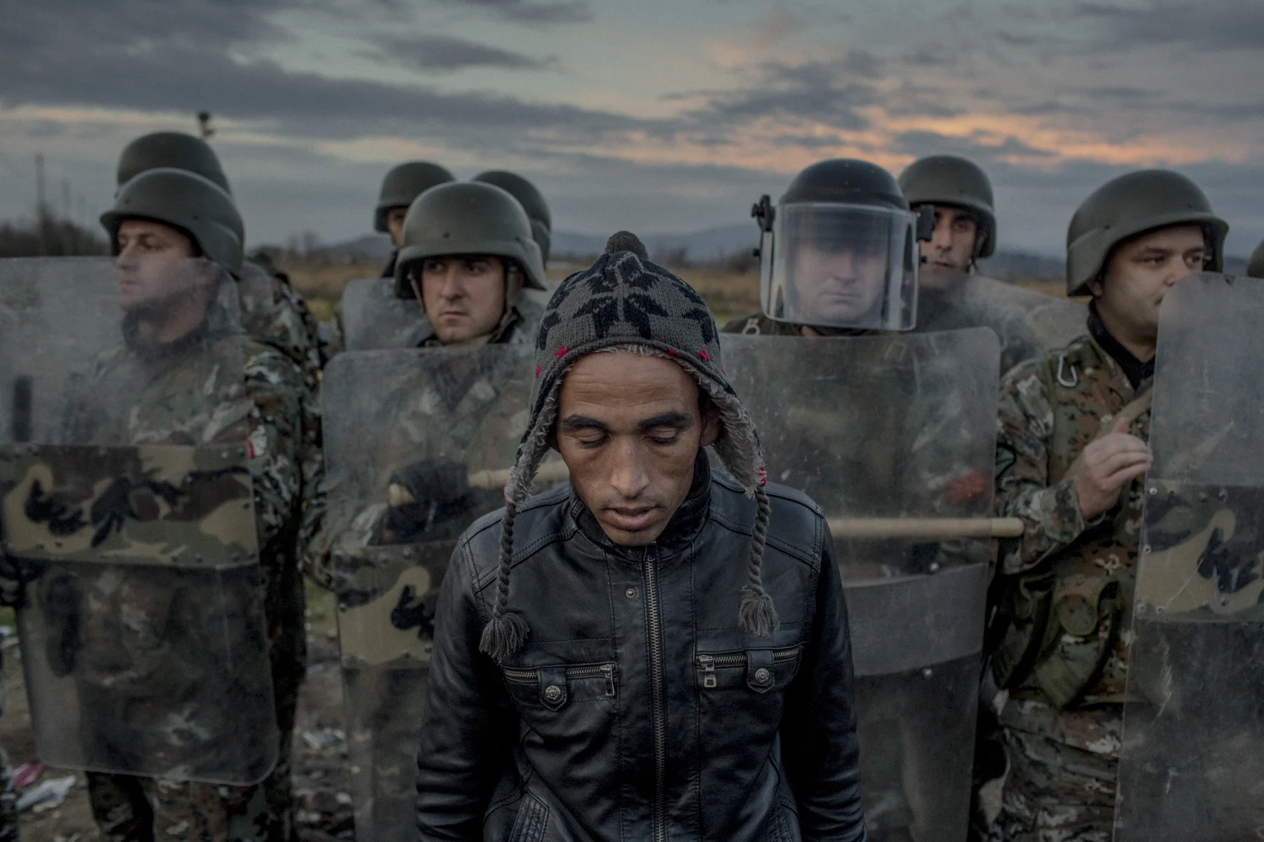 A Moroccan migrant seen in front of Macedonian police at the border between Macedonia and Greece.