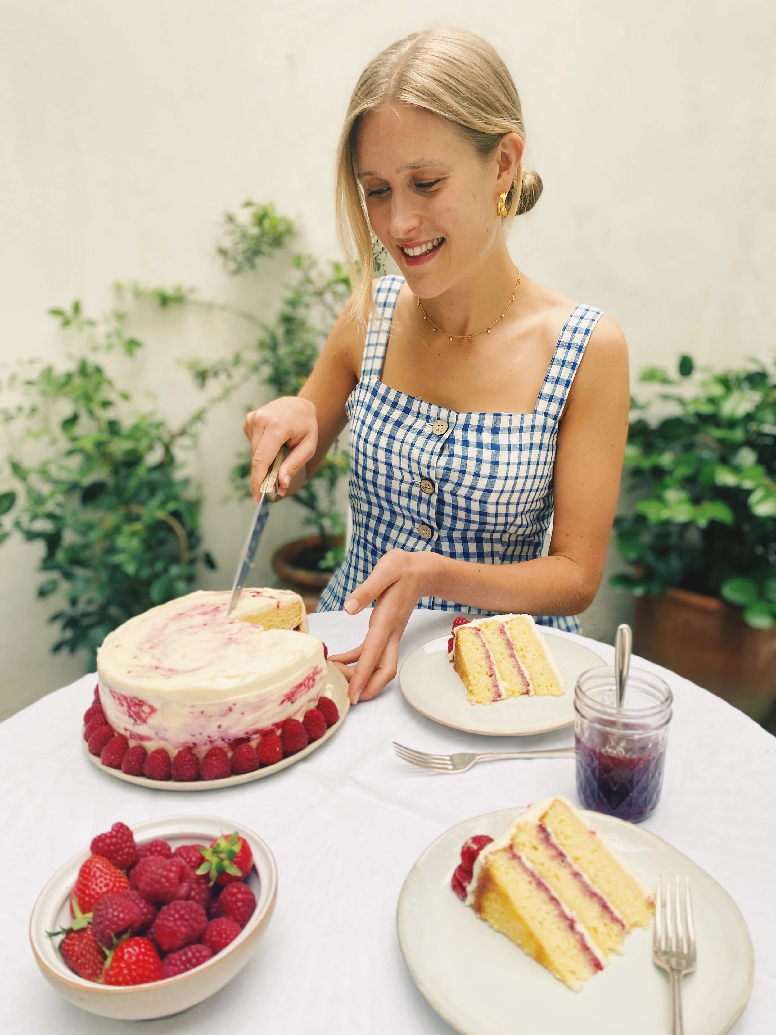 Lemon layered raspberry jam cake with marbled mascarpone icing