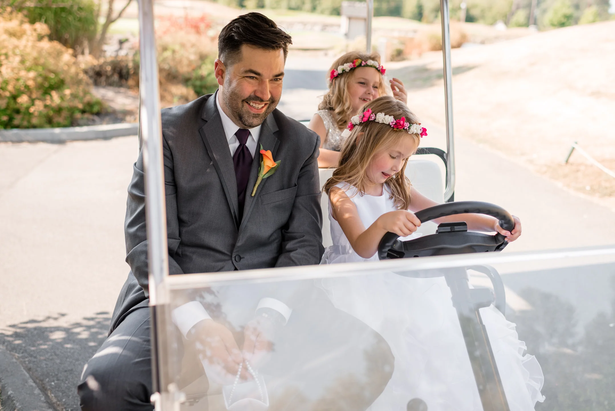Flower Girls and Groomsman Drive around in Golf Cart
