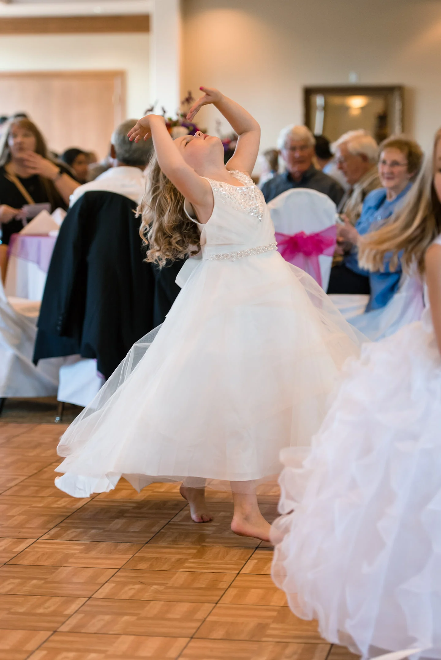 Flower Girl Dancing during Wedding Reception at Echo Falls Golf Course