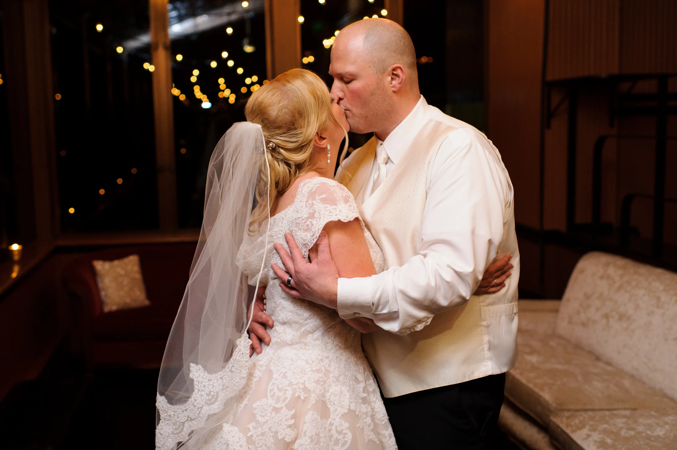 Bride and Groom Kiss At Lake Union Cafe