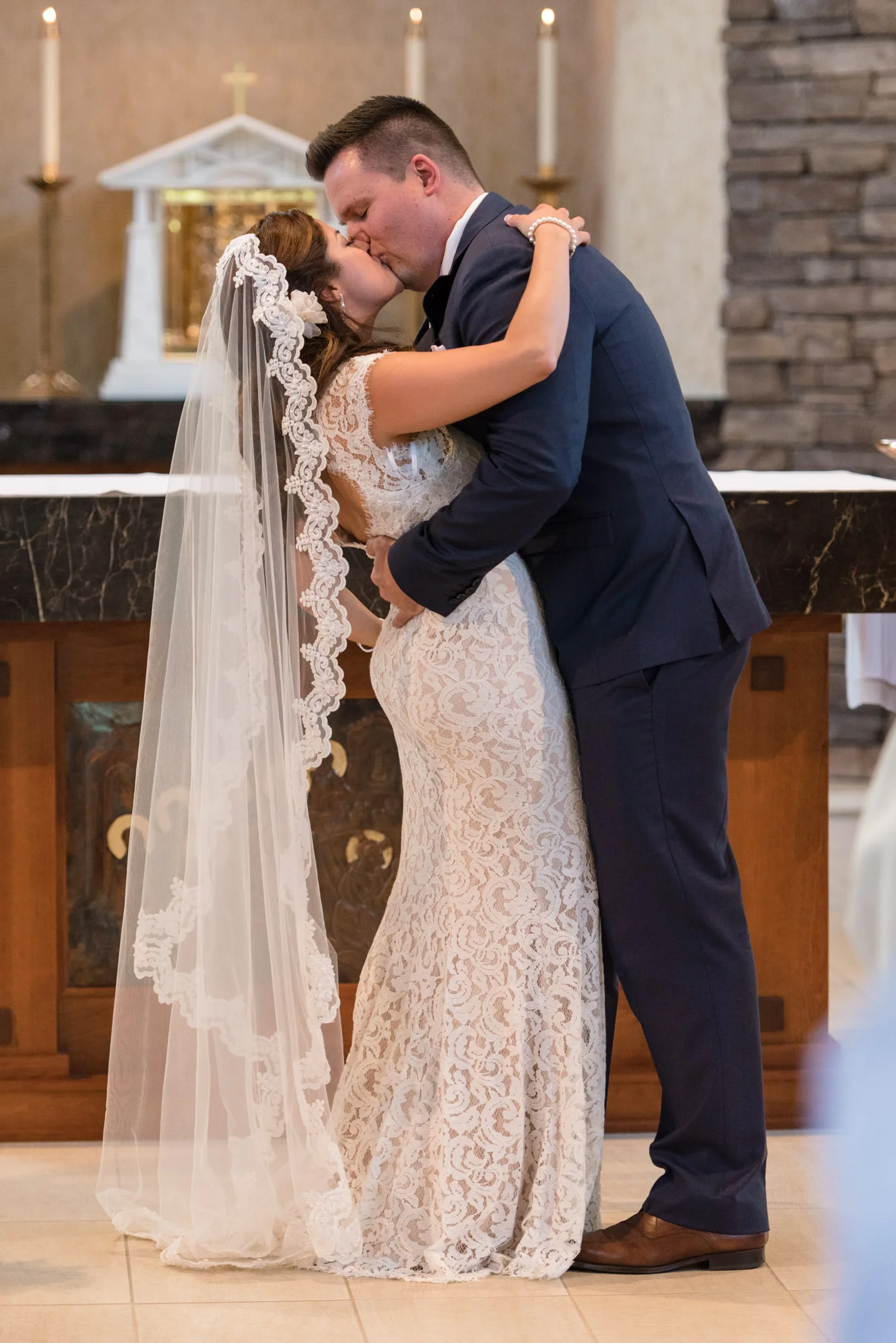 Salvadoran Bride and Groom Kiss during Wedding Ceremony