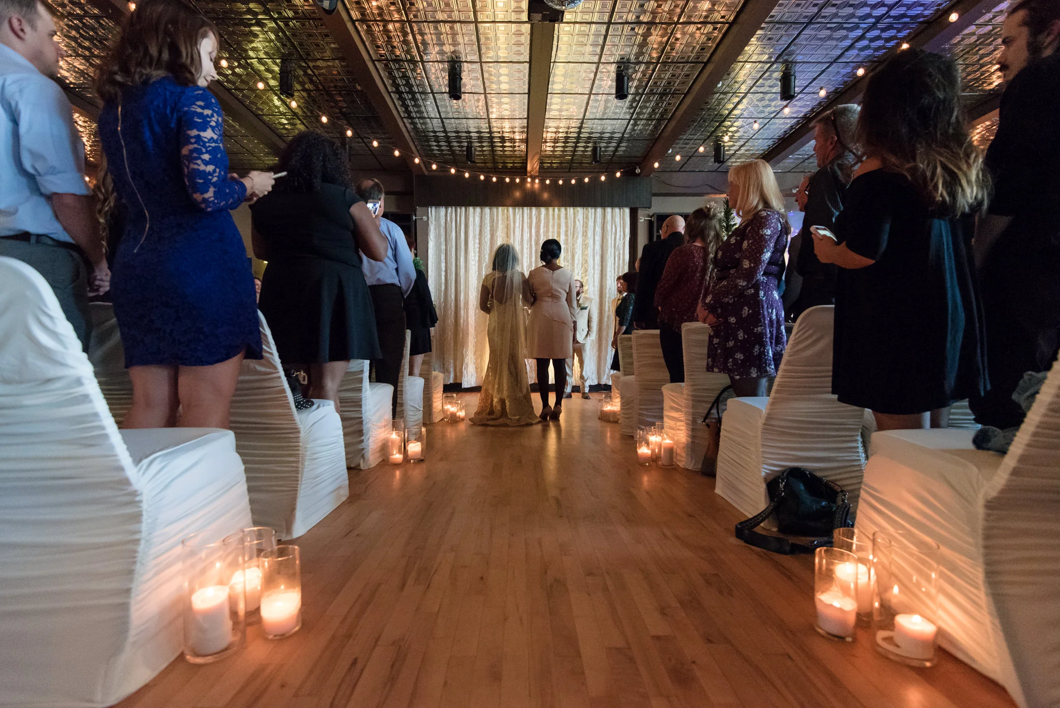 Bride and Mother Walk Down the Aisle During Wedding Ceremony