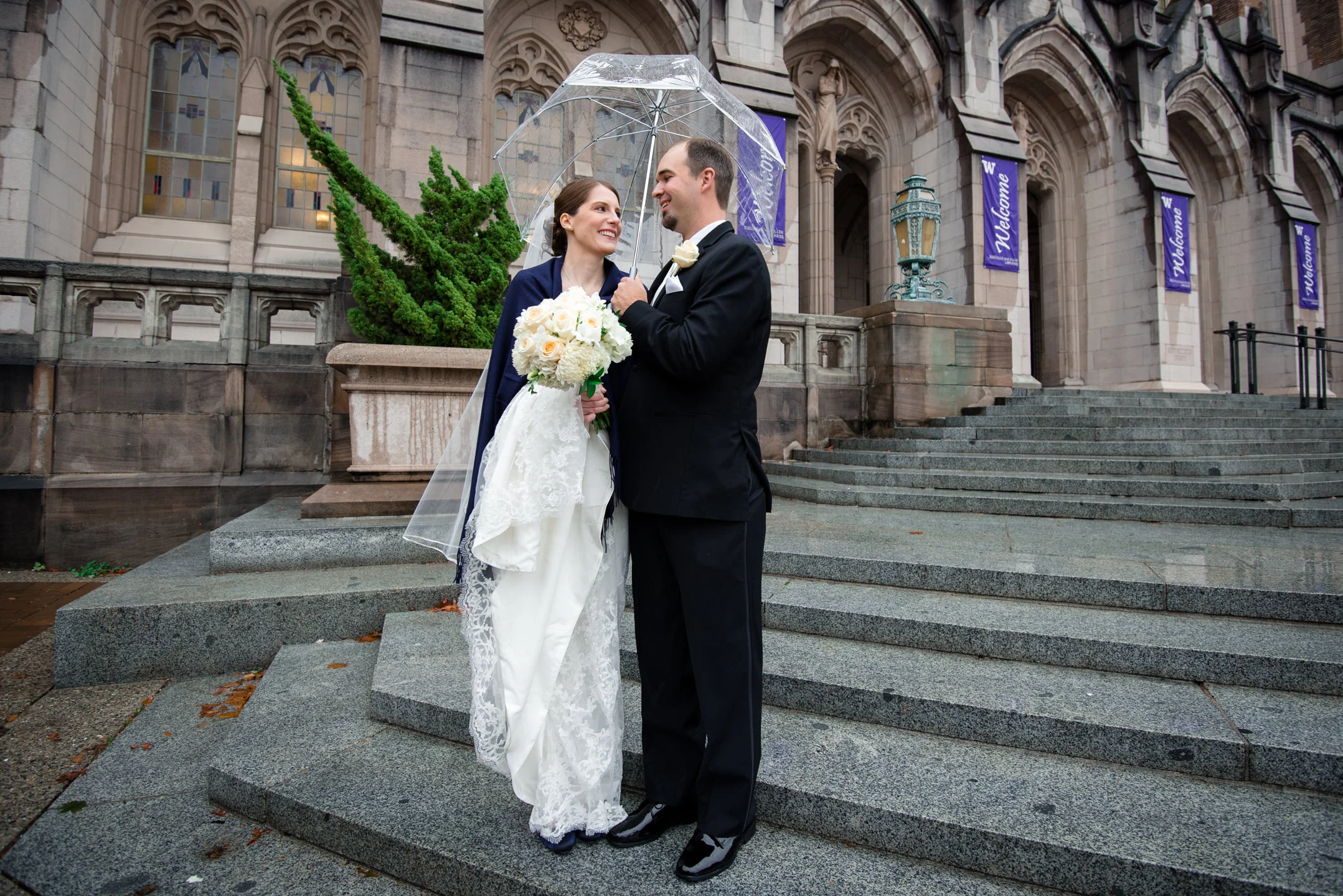 Bride and Groom Cuddle at Suzzallo Library
