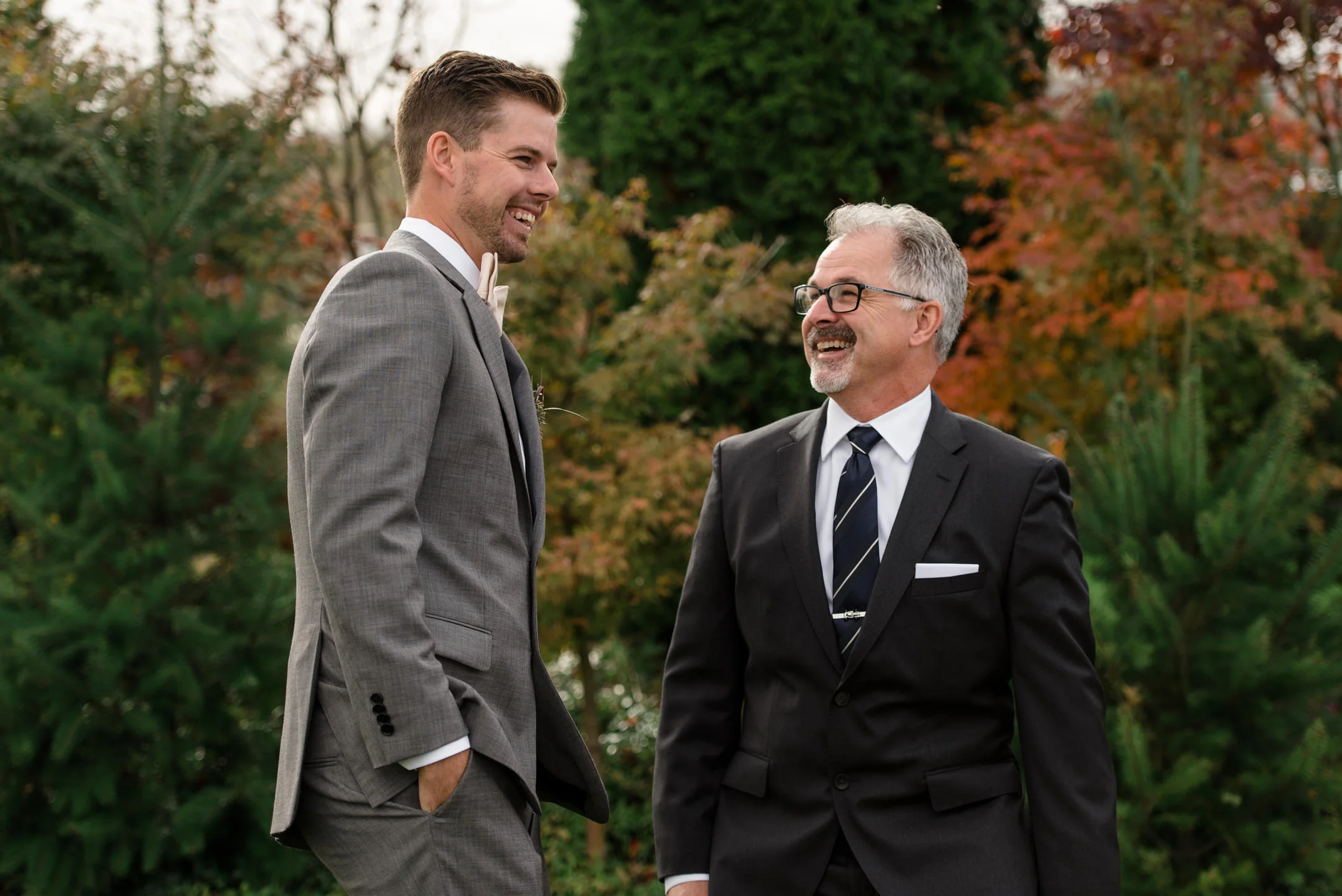 Groom and Father Happy Laugh during Family Portraits