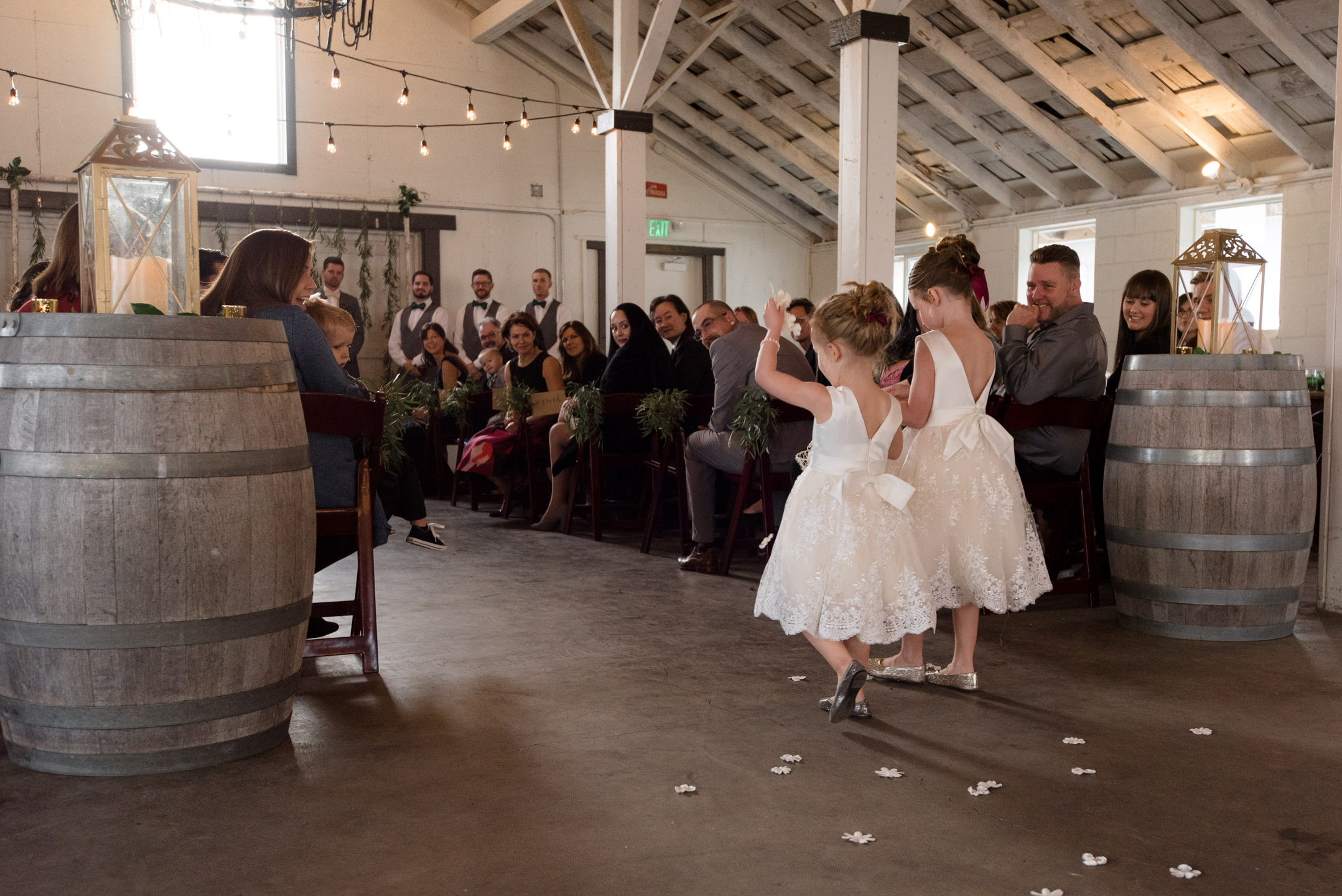 Flower Girls Walk down Aisle during Wedding Ceremony