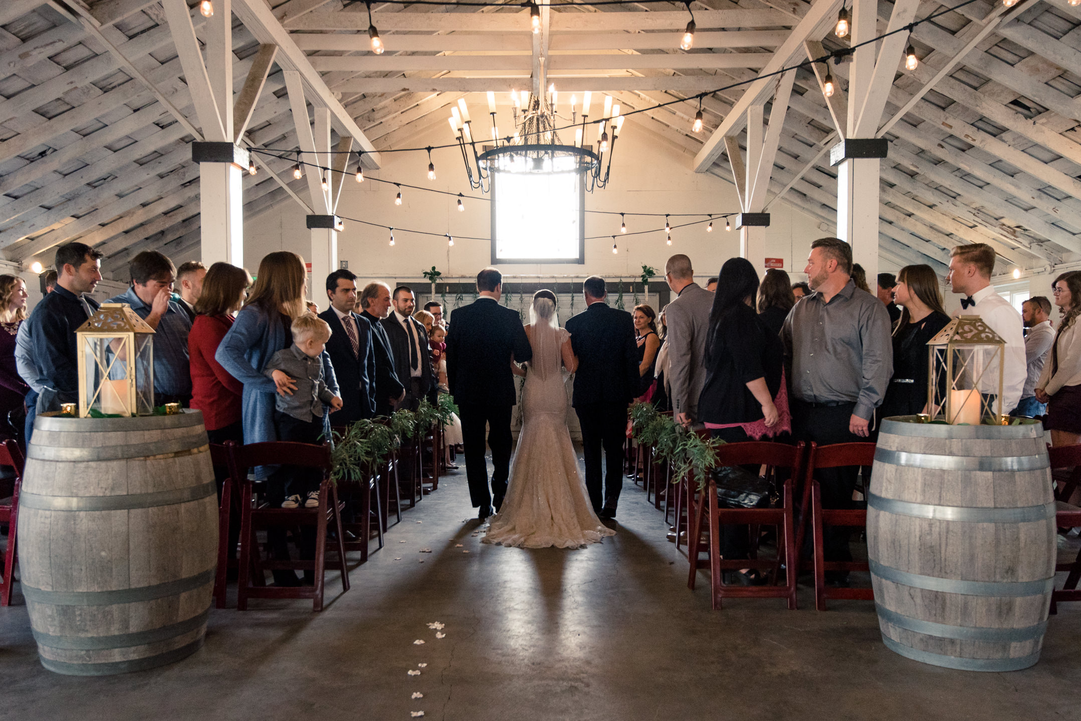 Bride and Fathers Walk down Aisle during Wedding Ceremony