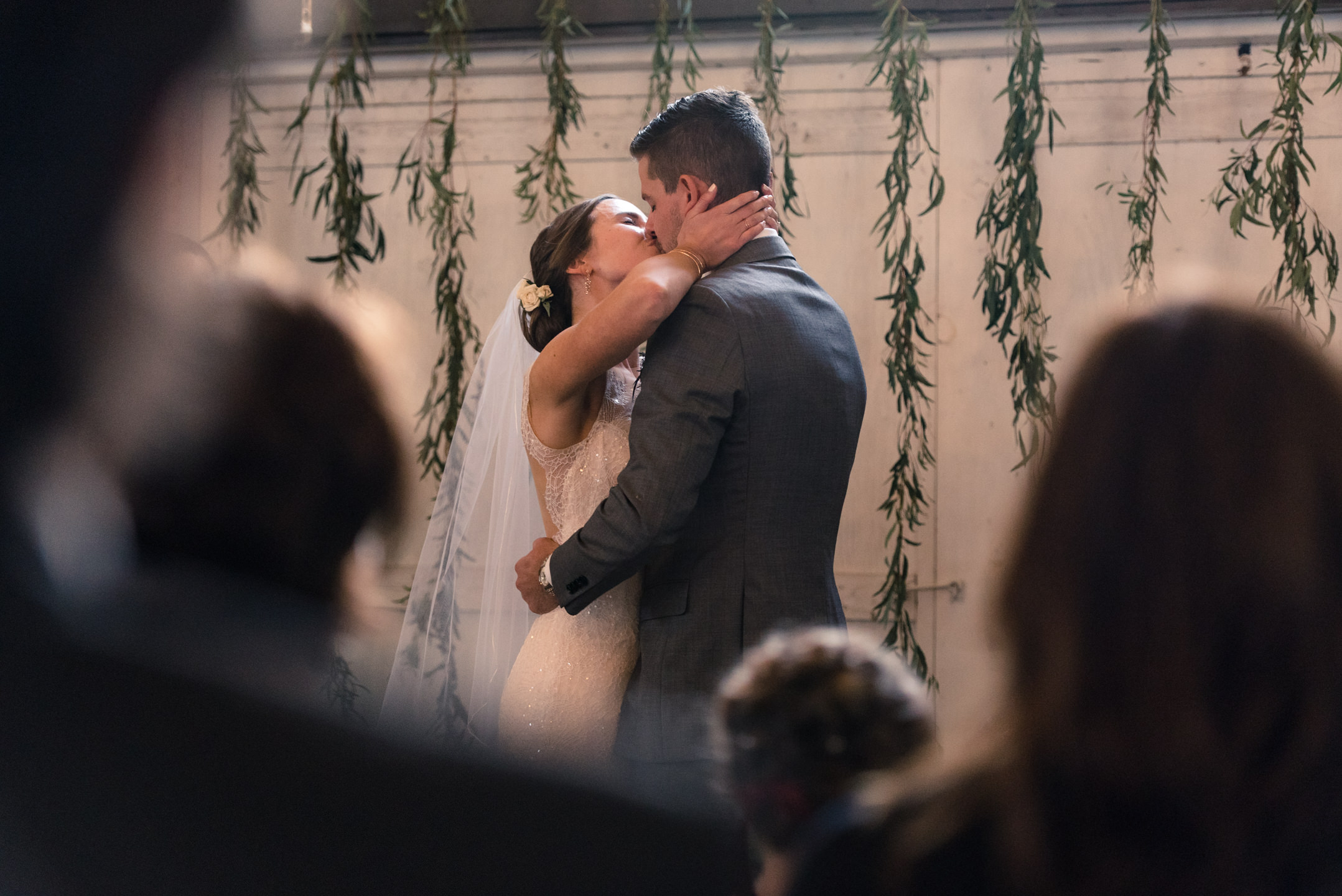 Bride and Groom Kiss during Wedding Ceremony