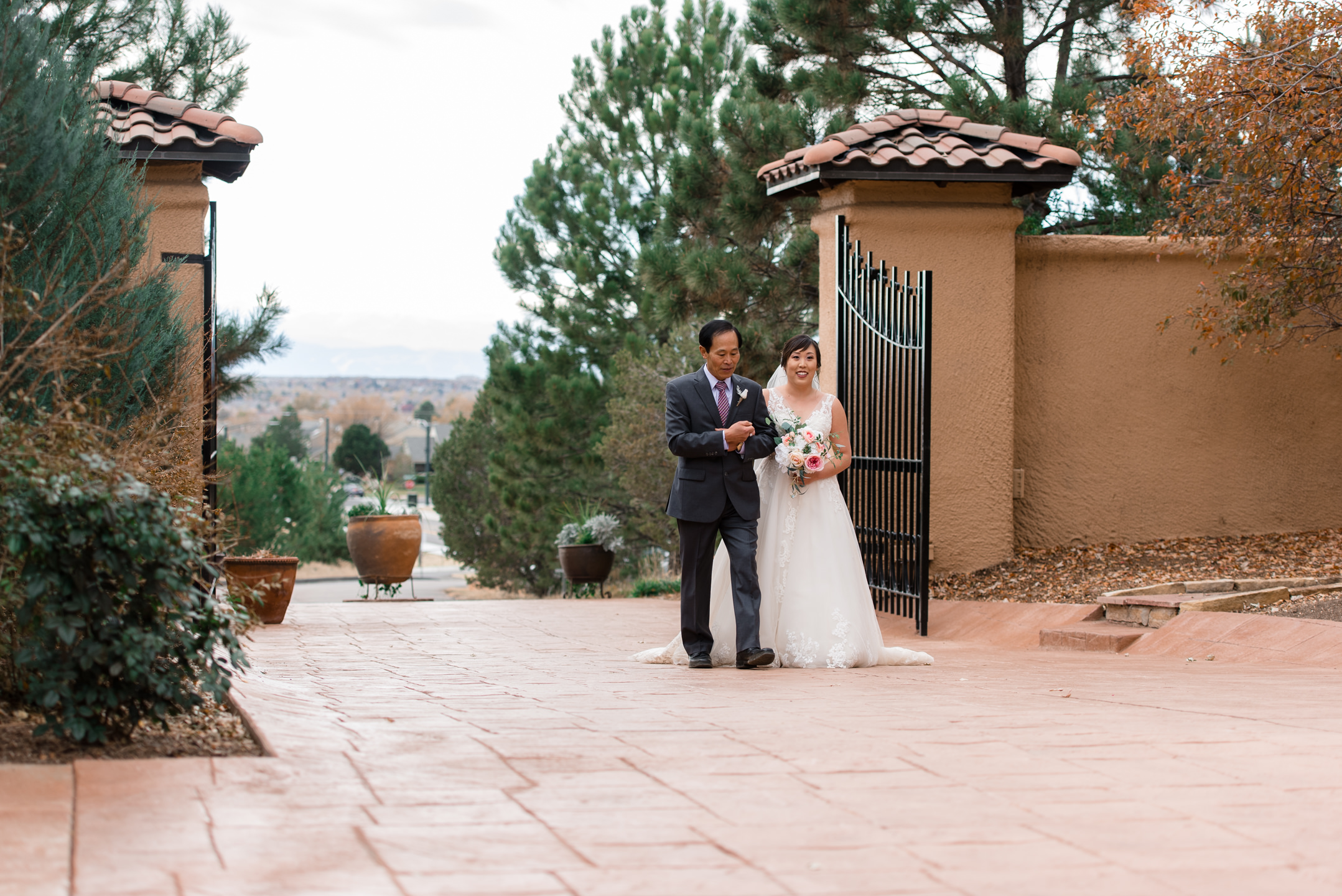 Asian Bride and Father Walk into Wedding Ceremony at Villa Parke