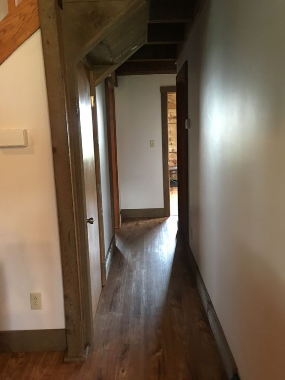 hallway leading into 1st floor bedrooms and full bath