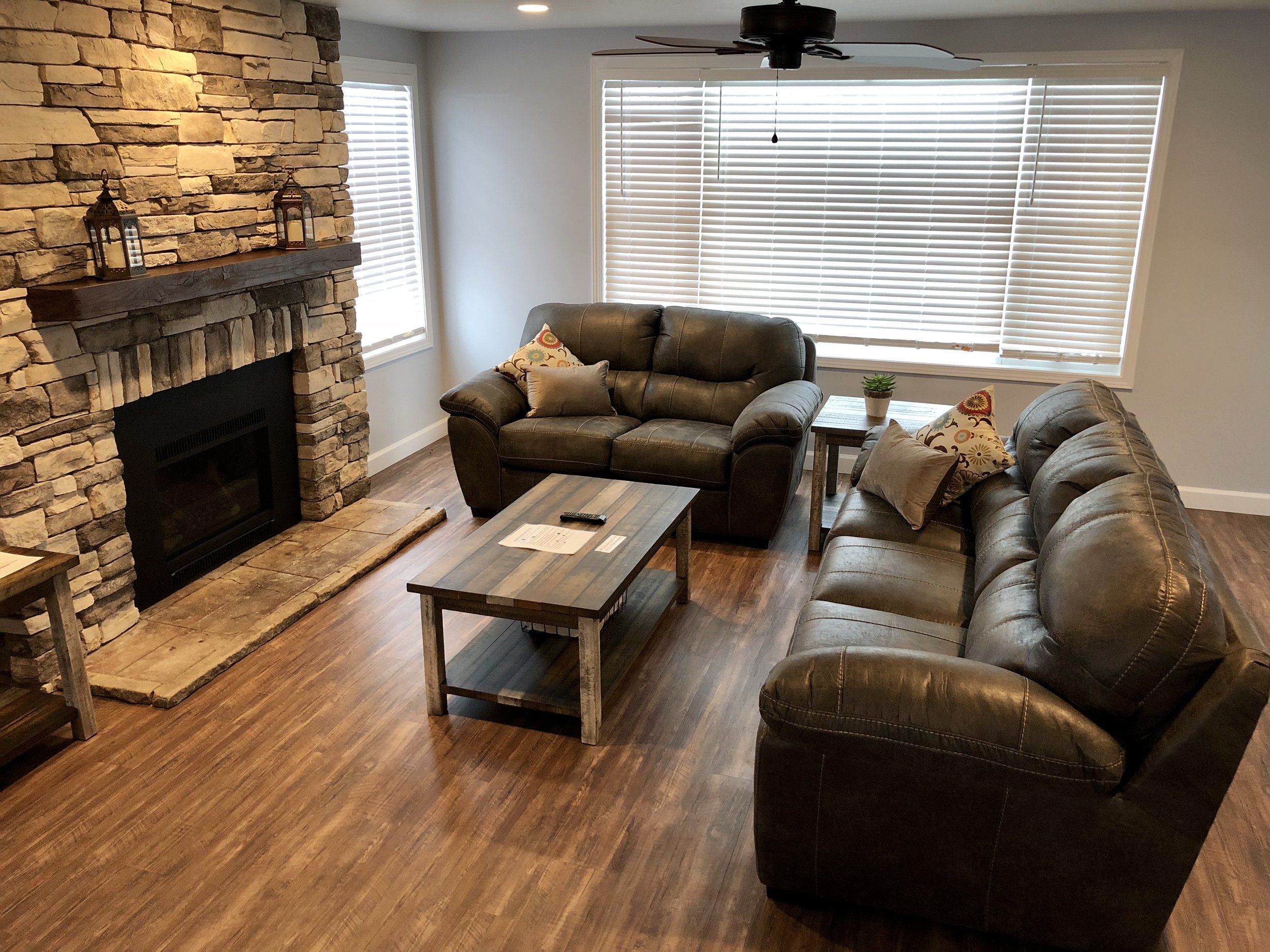 Living room has a 50" TV and a gas fireplace