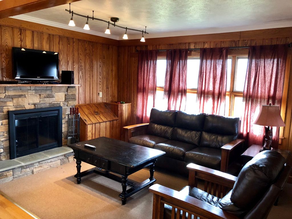 Living room with wood burning fireplace