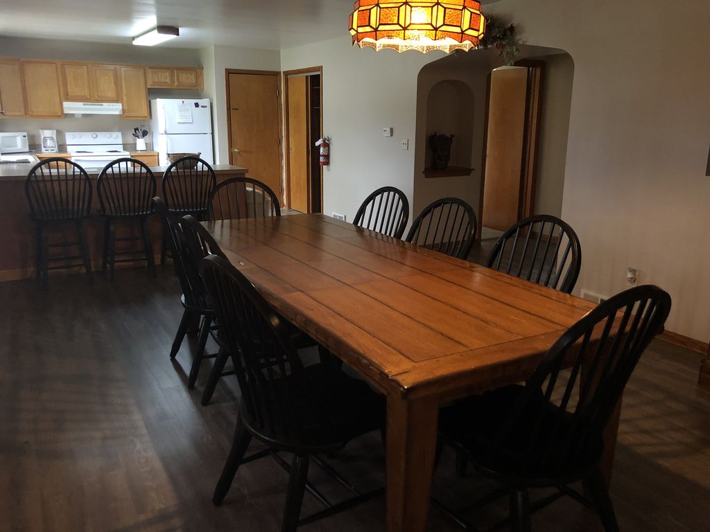 Dining room looking into the kitchen where you will see additional seating at the kitchen island
