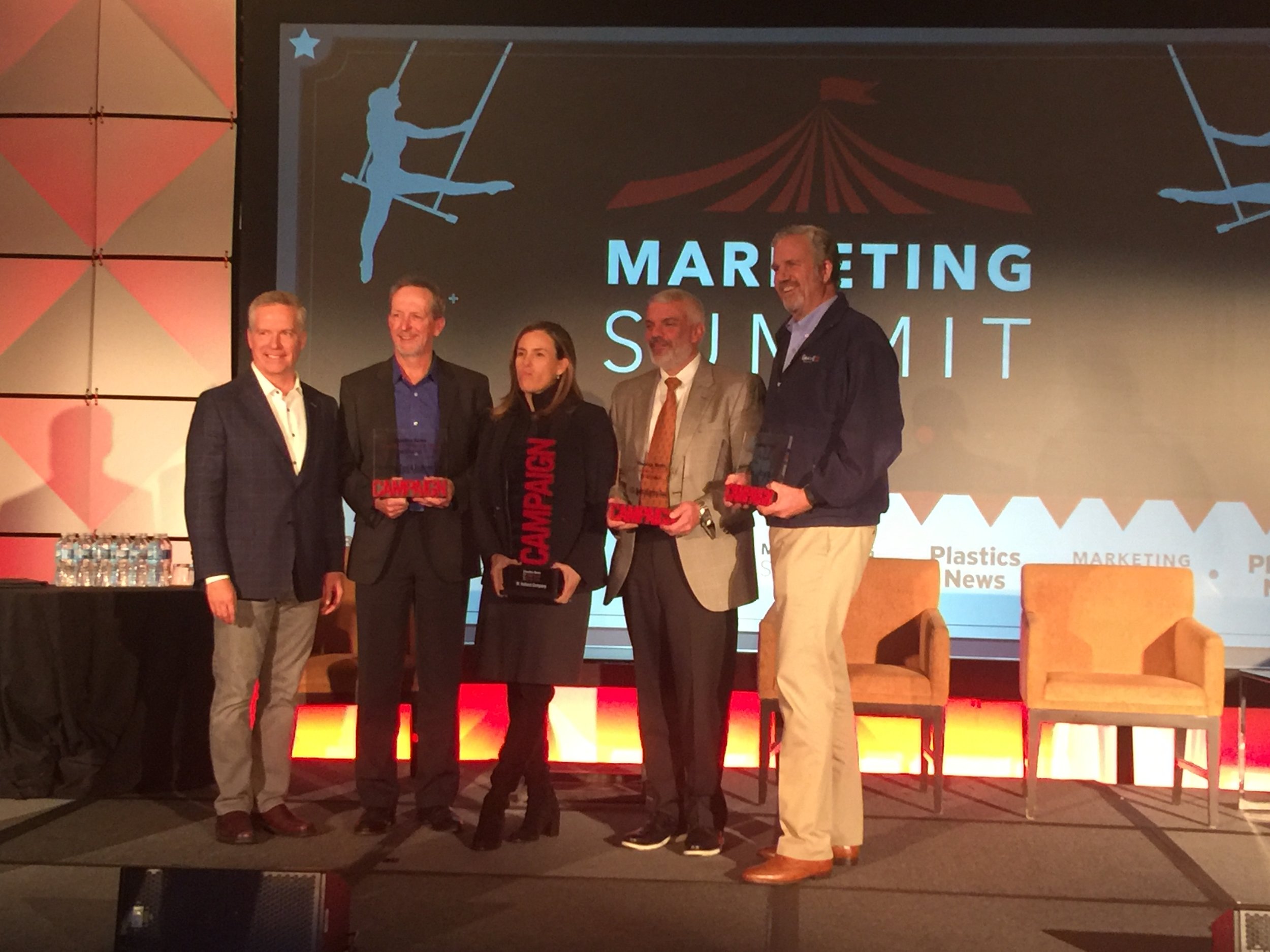 Plastics News Publisher Brennan Lafferty (l) with the finalists for "PN Marketing Campaign of the Year" at the 2018 PN Marketing Summit