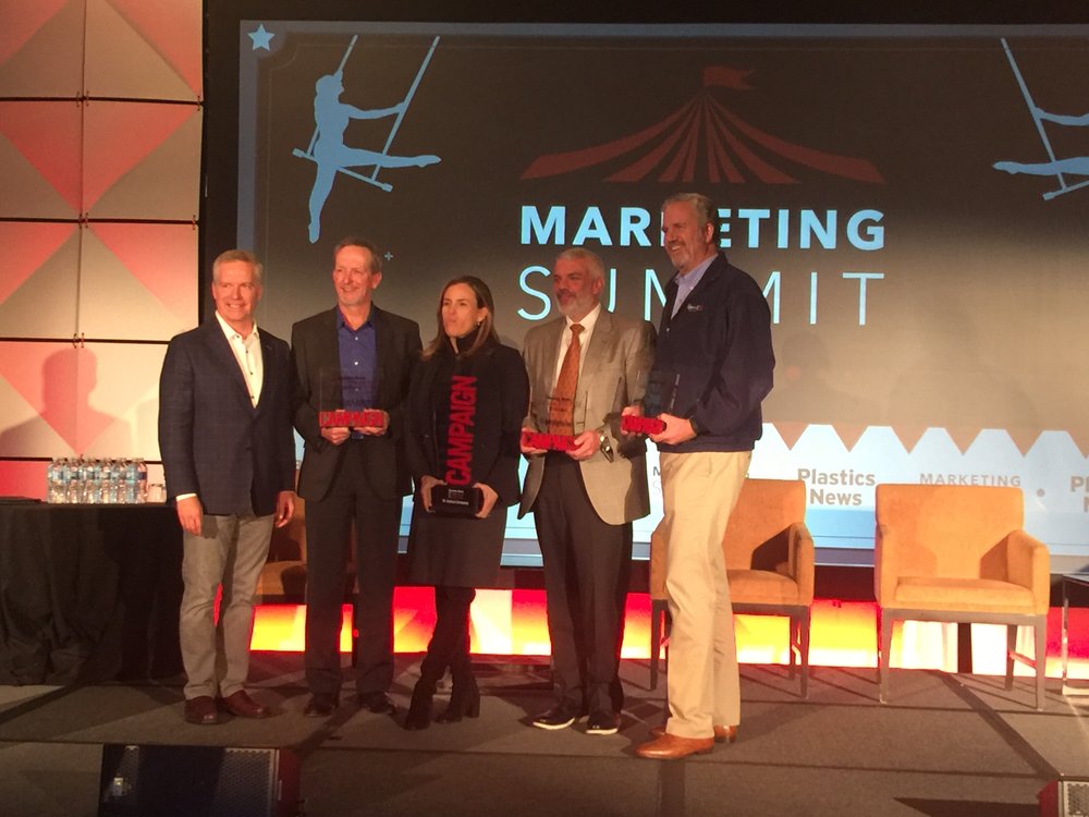 Plastics News Publisher Brennan Lafferty (l) with the finalists for "PN Marketing Campaign of the Year" at the 2018 PN Marketing Summit