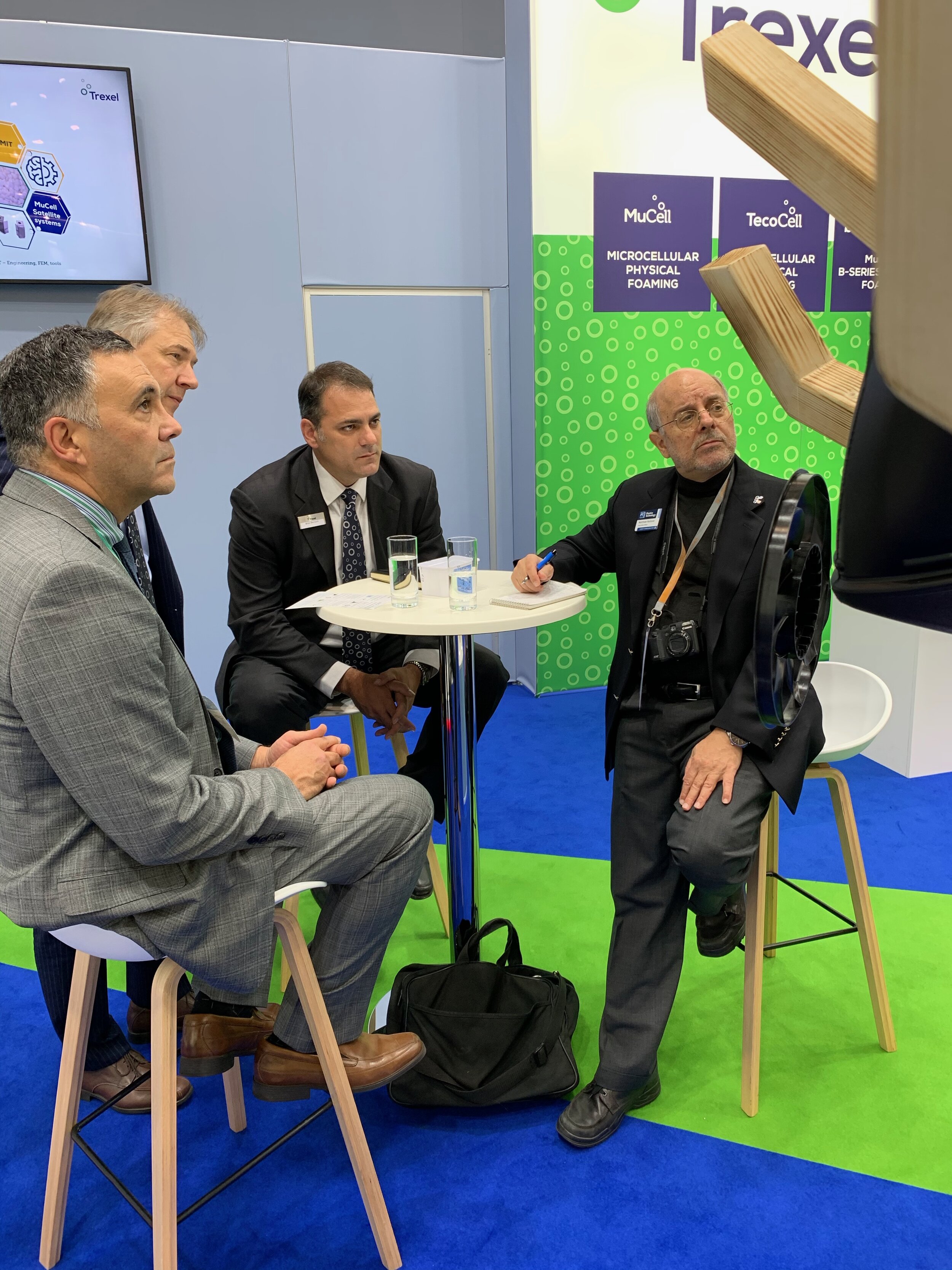  October 19: Matt Naitove (right), Editor of Plastics Technology magazine, meets with Trexel President Brian Bechard (second from right), Trexel Global Product Manager/Sales Markus Betsche, and Next Step’s Greg Hannoosh (left) at Trexel’s booth  
