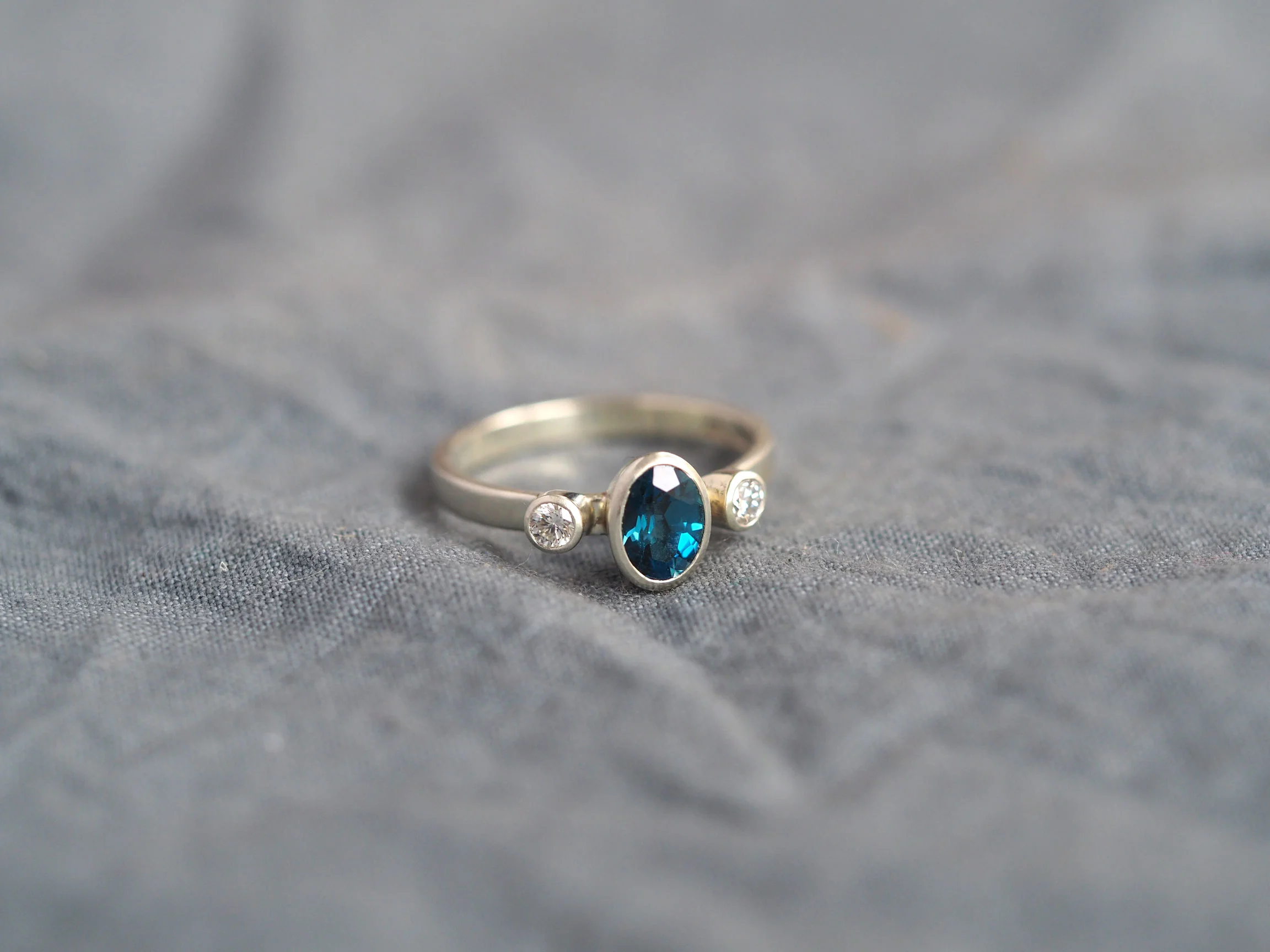 lead-image-2-9ct-white-gold-diamond-and-london-topaz-ring-web.jpg