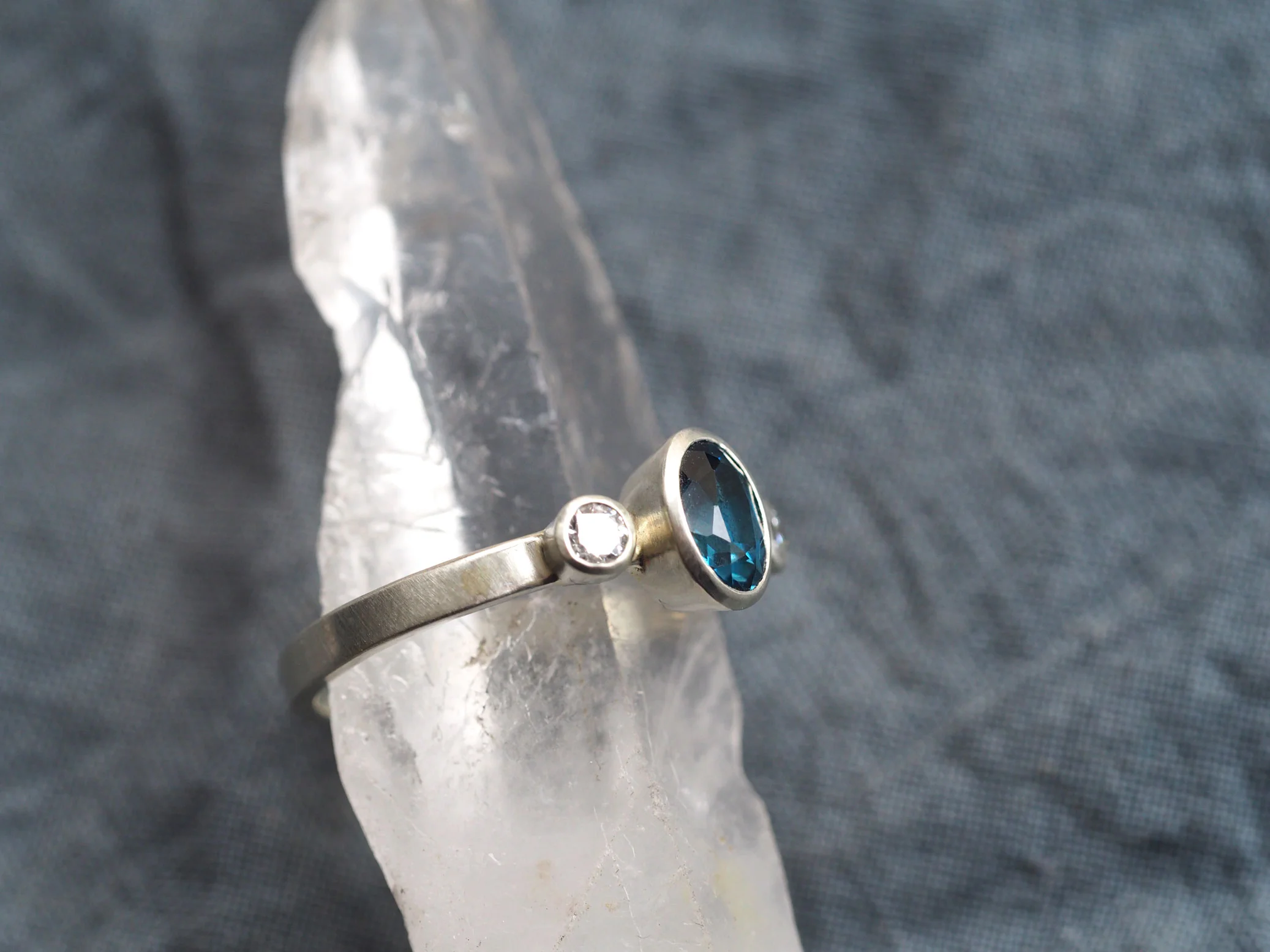 side-image-9ct-white-gold-diamond-and-london-topaz-ring-web.jpg