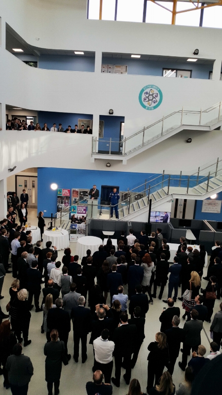 Crowd gathered in the UTC Portsmouth atrium for the official opening ceremony, with speakers addressing from the staircase.