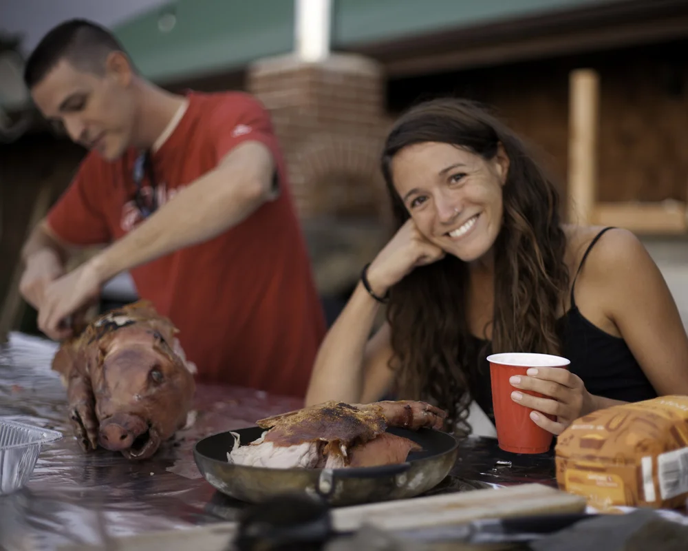 Emily and Ryan posing with the pig head