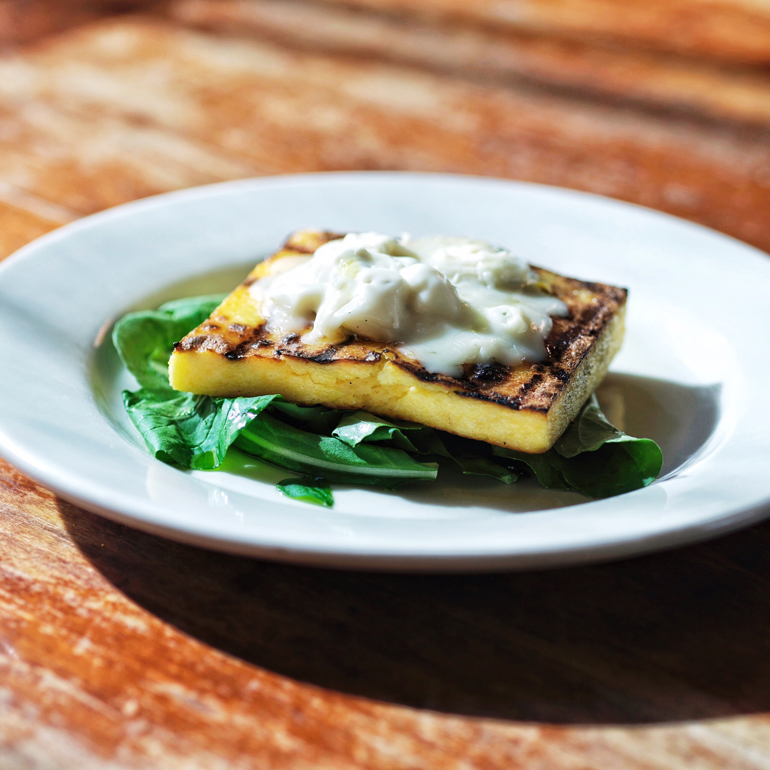 Grilled Polenta and Gorgonzola Over Arugula 