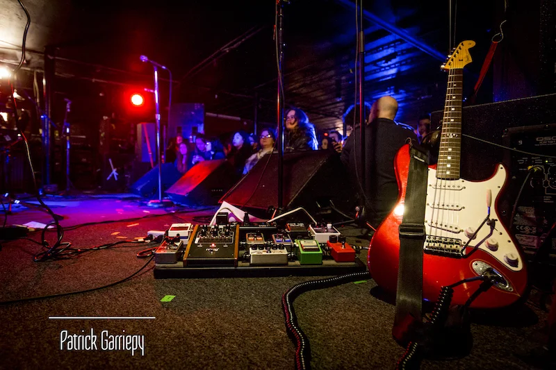 The Marias gear and equipment on stage ahead of their set.