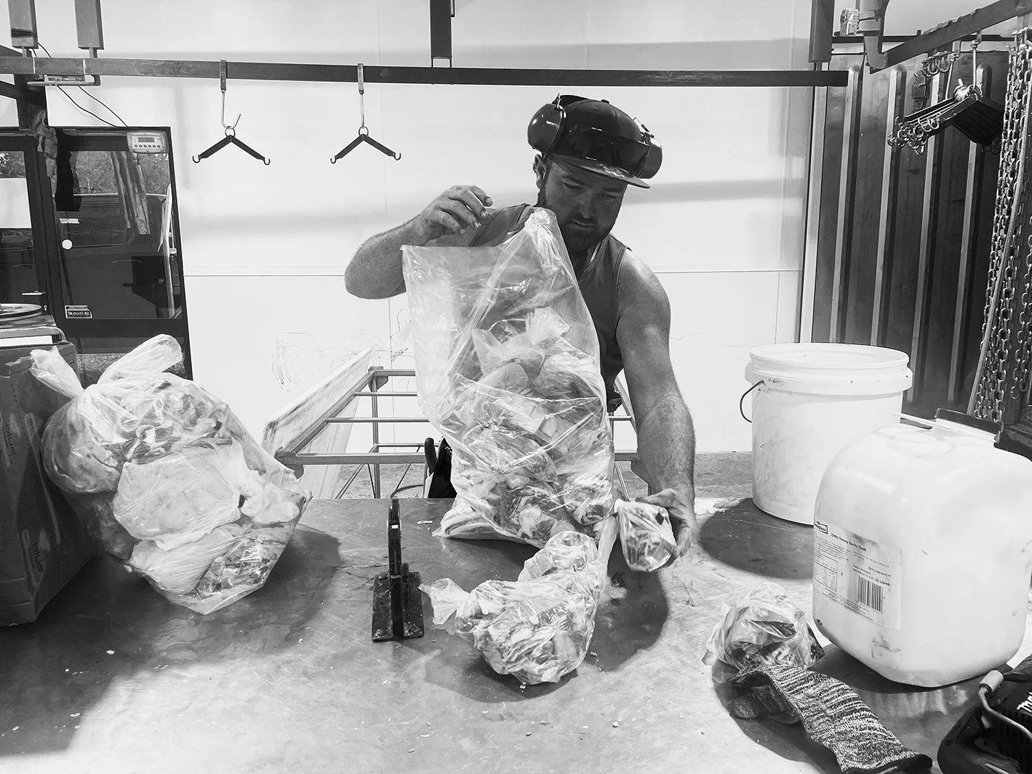 Butcher packaging a sheep carcase