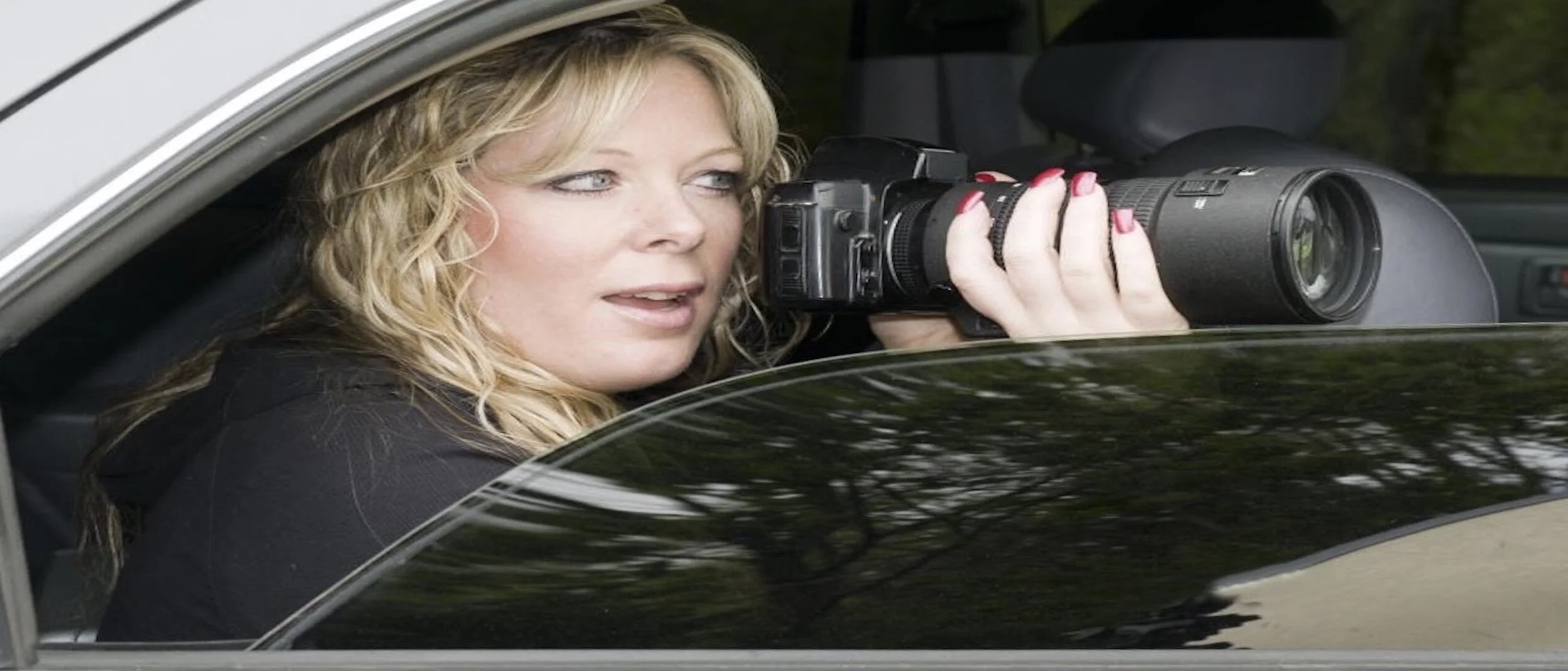 woman-private-investigator-with-camera 2.jpeg