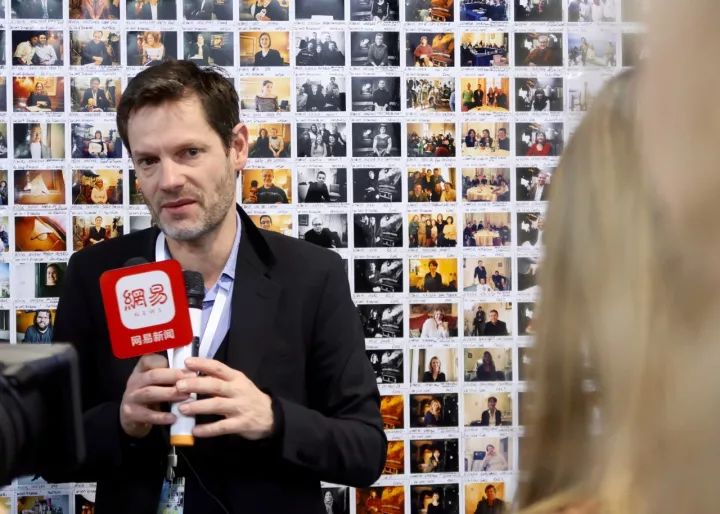 Sam Stourdzé speaking to local media at Jimei Citizen Square main exhibition hall © Marine Cabos