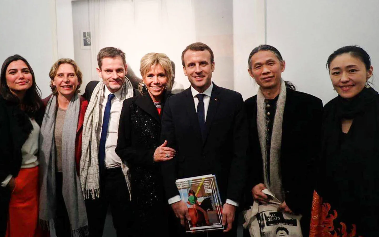 (From left) Victoria Jonathan (General manager of 2017 Jimei x Arles), Bérénice Angremy (Director of 2017 Jimei x Arles), Sam Stourdzé (Director of Rencontres d'Arles), French President Emmanuel Macron and his wife Brigitte Macron, RongRong (founder of Three Shadows and Jimei x Arles) & inri (founder of Three Shadows and Jimei x Arles) at Ullens Center for Contemporary Art (UCCA) on 9 January, 2018