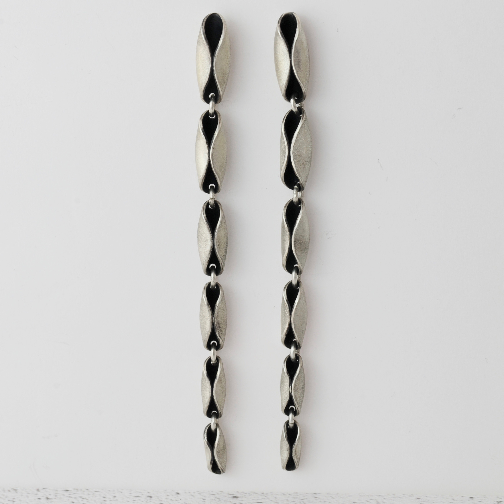 Long statement oxidised silver windblown earrings.jpg