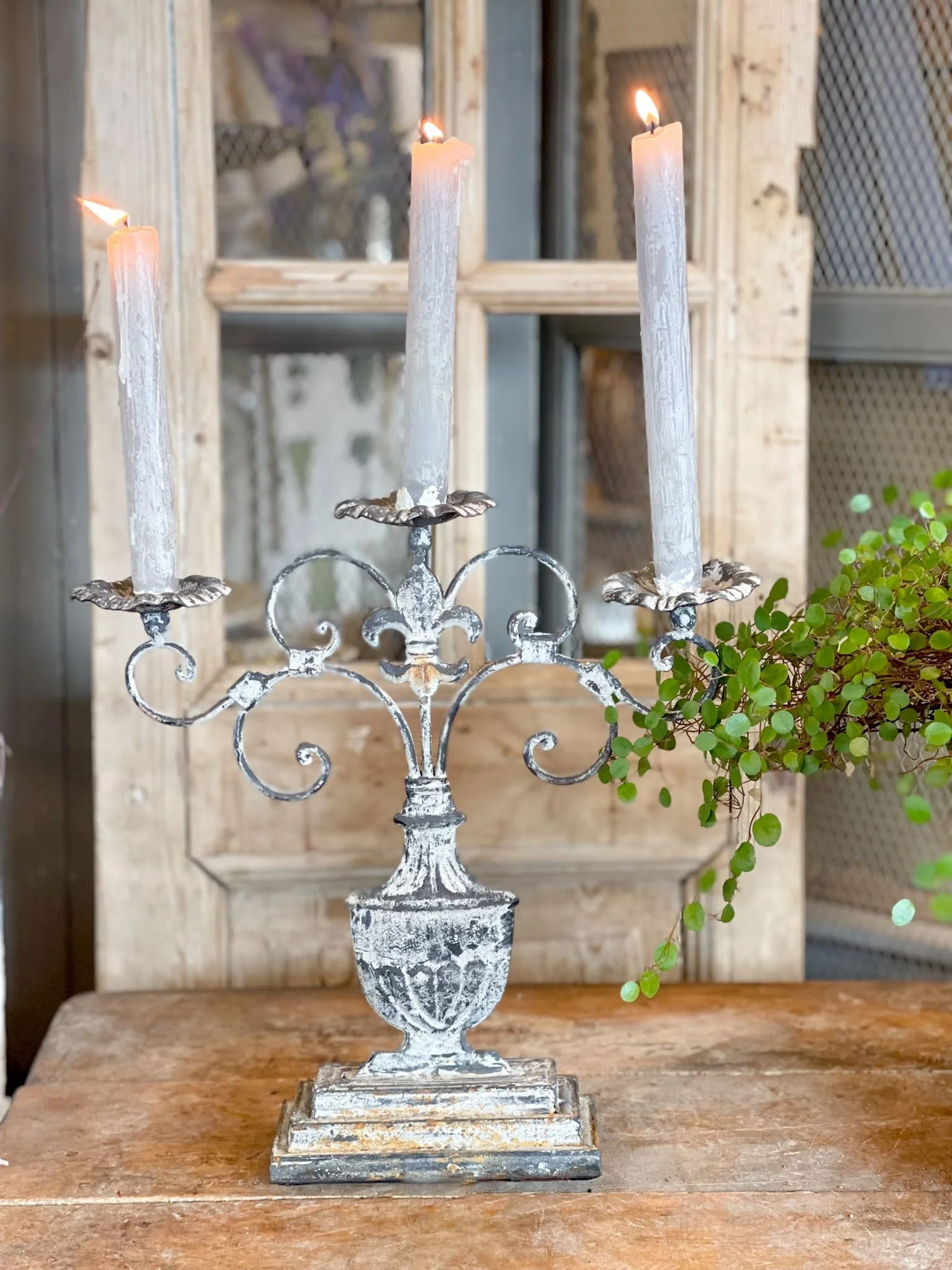 french-iron-whitewash-candelabra-fleur-de-lys-scrollwork-candle-holder.jpg