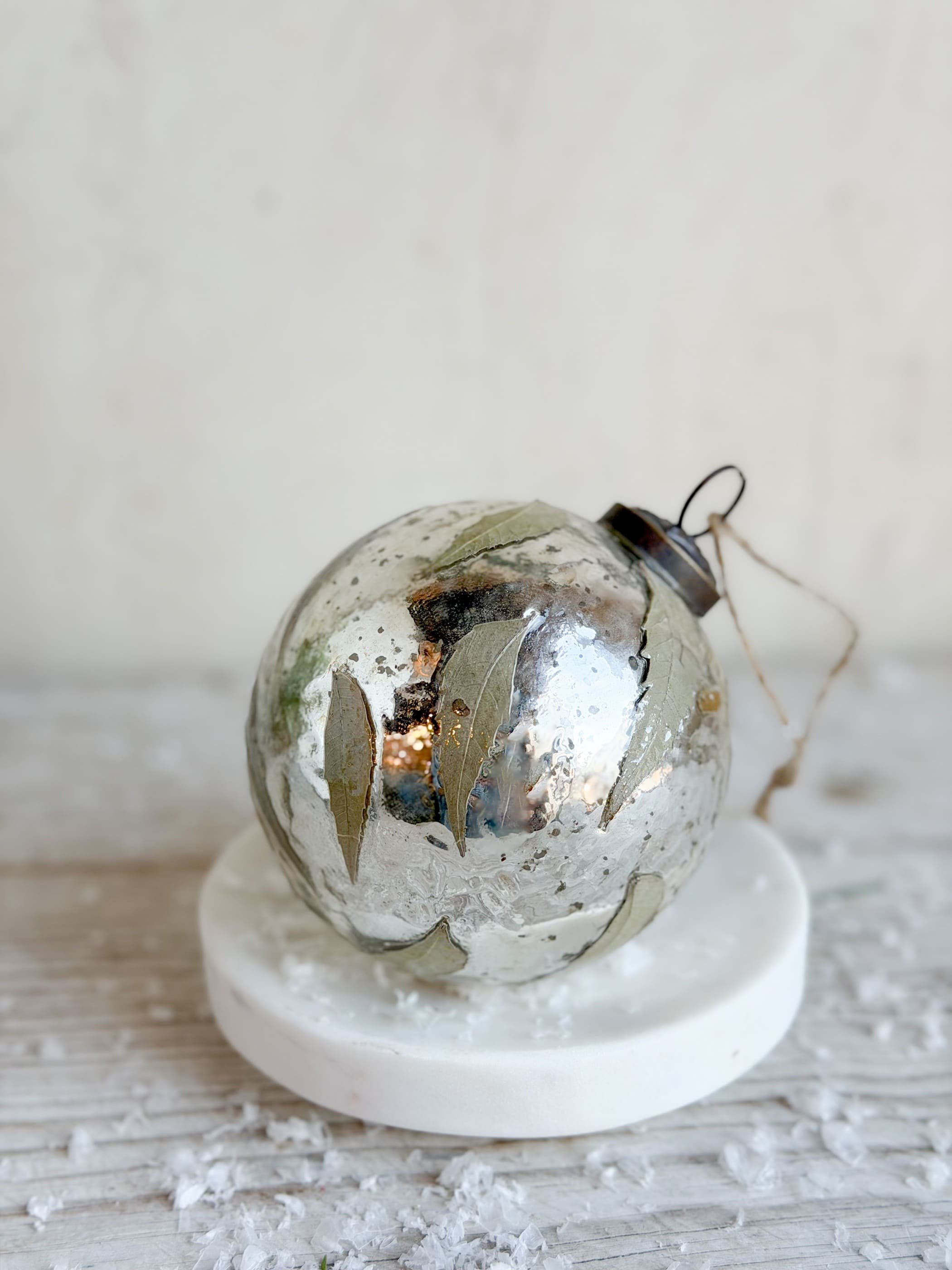 Patinaed Silver Glass Ball Ornament with Leaf Appliques