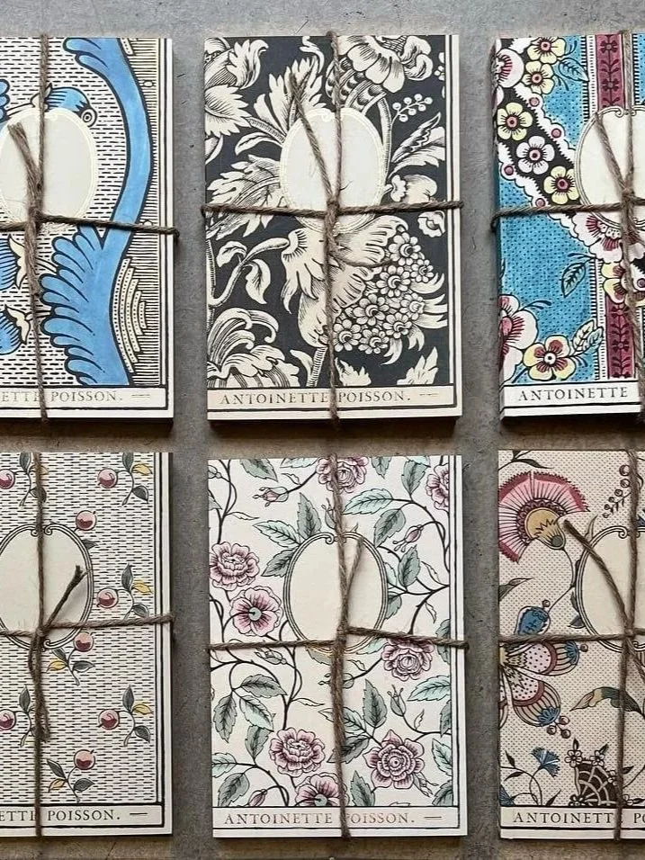 antoinette-poisson-french-domino-paper-notebooks-flat-lay-banner.jpg