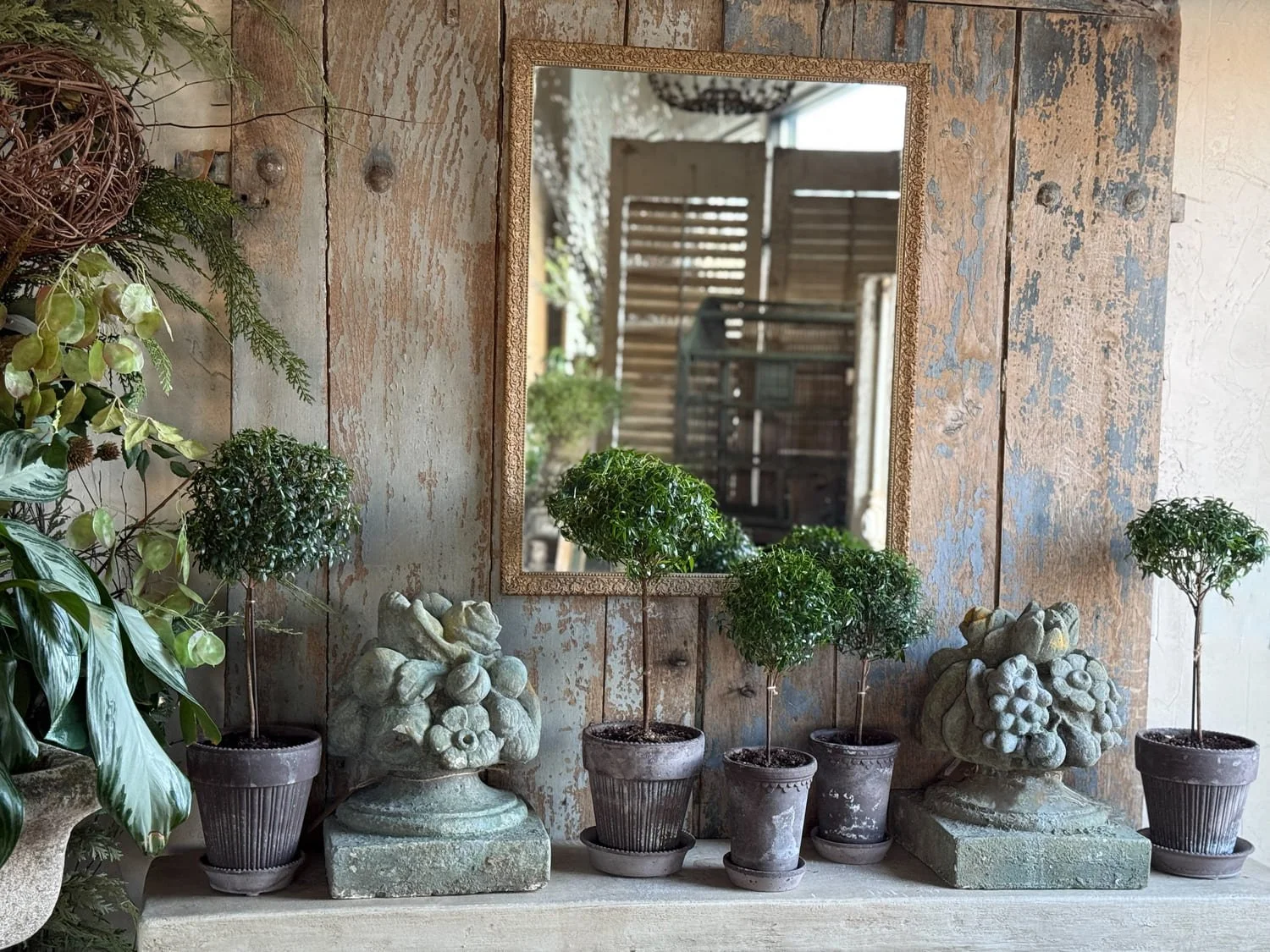 carved stone fruit basket statues potted topiary plants