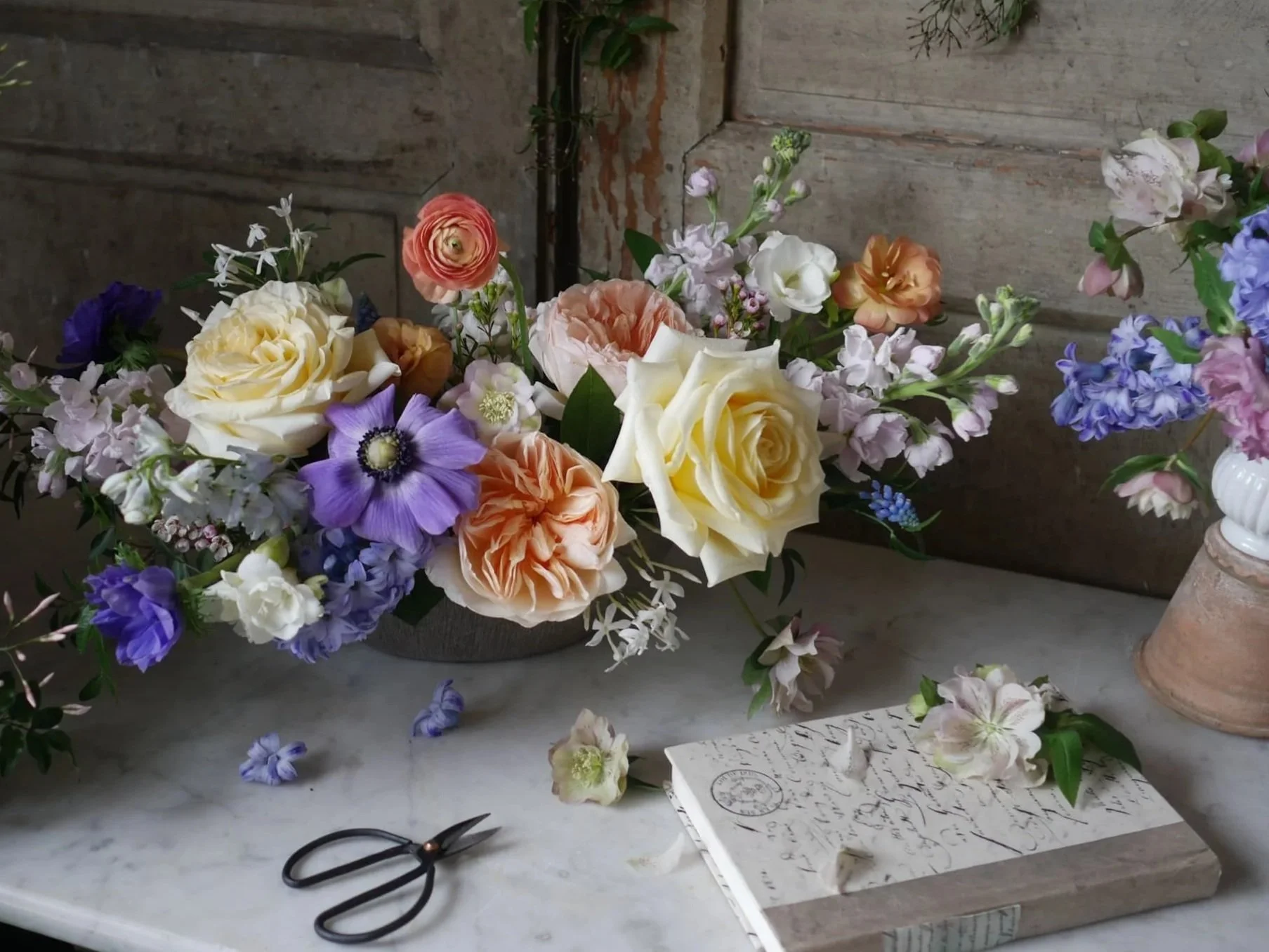 spring floral arrangement peach yellow purple easter table centerpiece